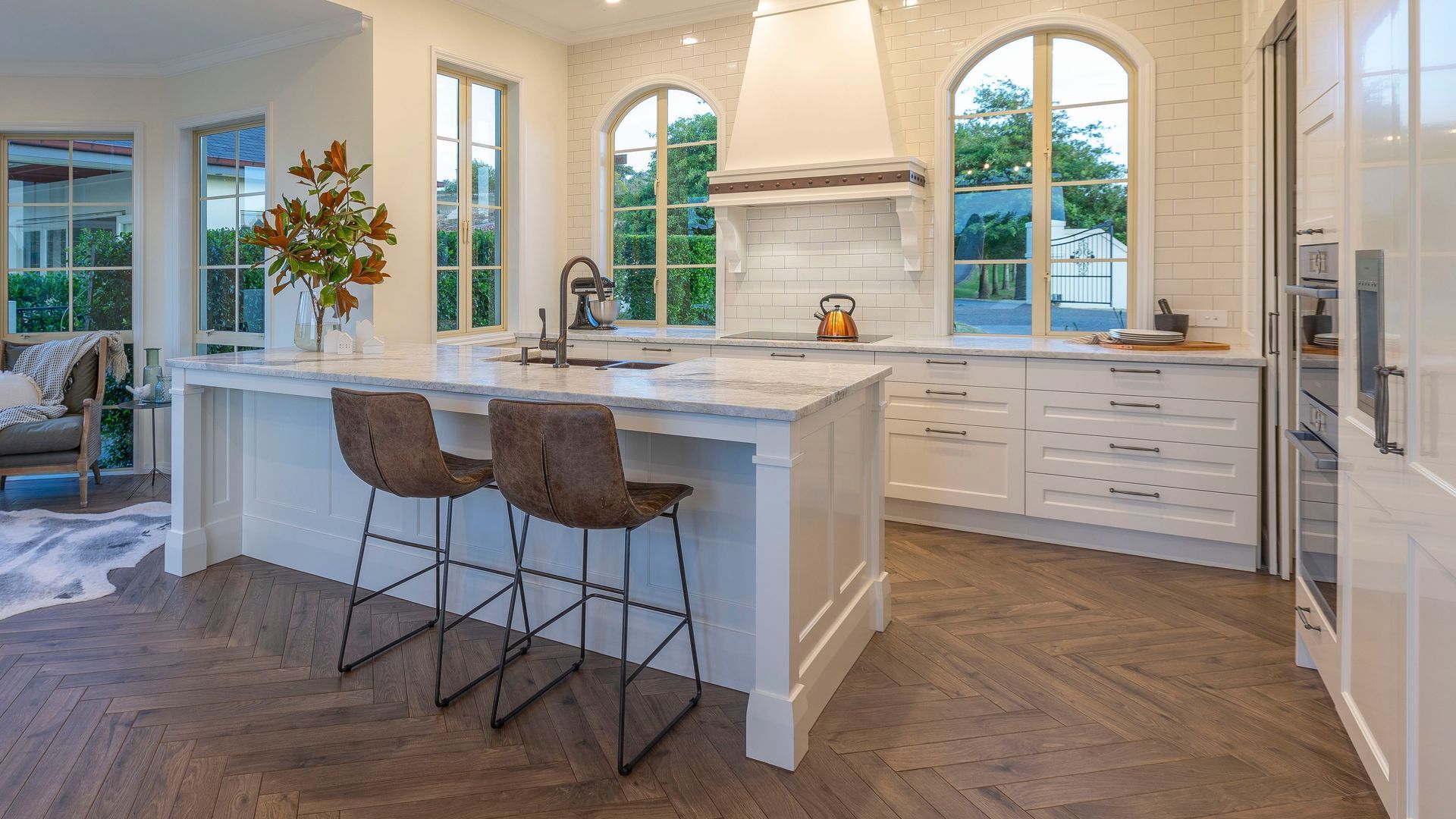A dramatically transformed kitchen befitting of its grand French-country architecture.