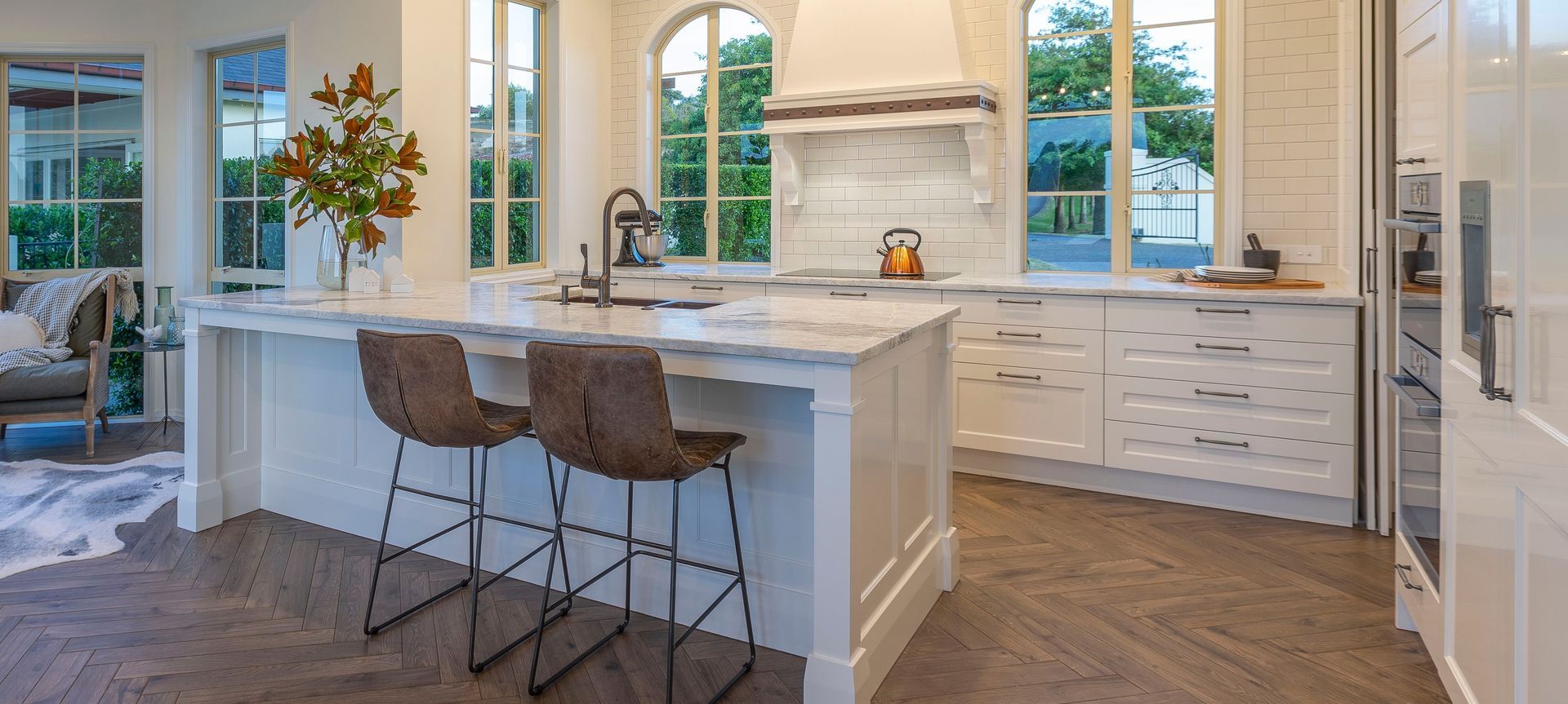 A dramatically transformed kitchen befitting of its grand French-country architecture.