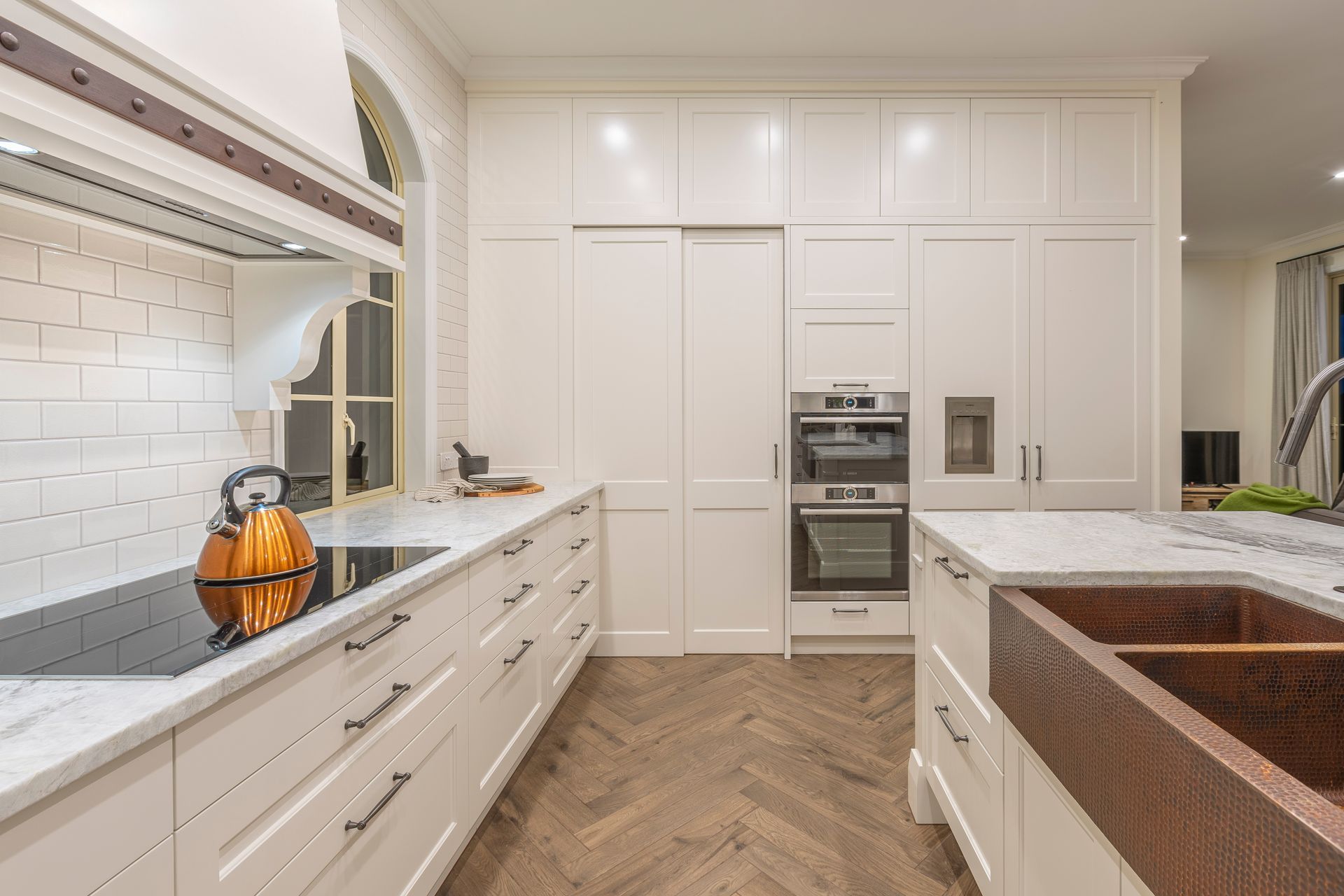 A key desired wish-list from the homeowner included a hand-hammered copper apron sink from Mexico.  Its rich texture and warm glow is a celebrated feature of the kitchen.  We made the island a little taller again to compensate for the extra deep bowls and give the taller home-chef a comfortable work space.