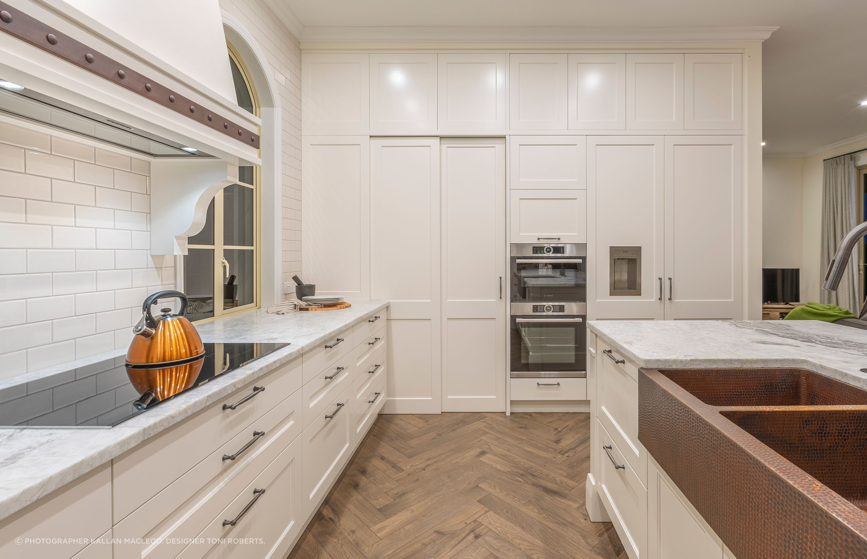 A key desired wish-list from the homeowner included a hand-hammered copper apron sink from Mexico.  Its rich texture and warm glow is a celebrated feature of the kitchen.  We made the island a little taller again to compensate for the extra deep bowls and give the taller home-chef a comfortable work space.
