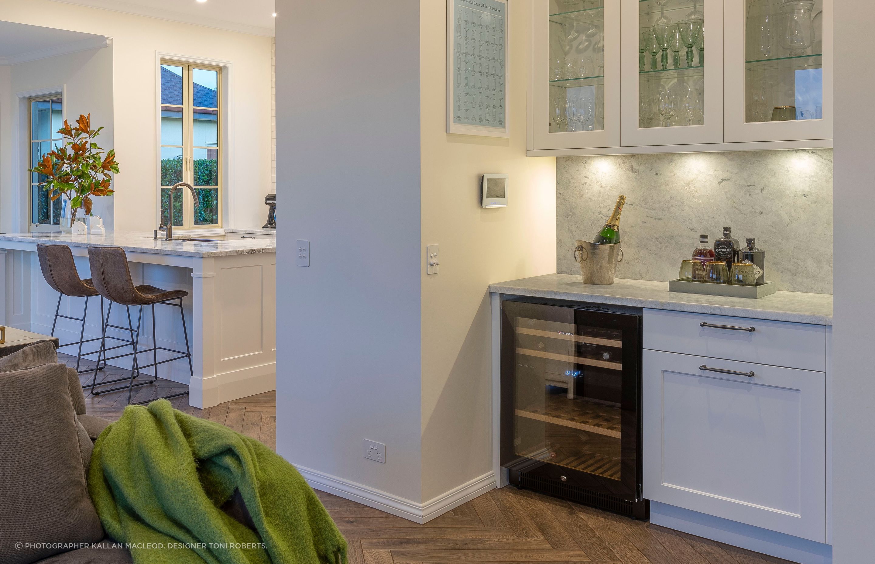 By shifting the Pool Room door for better logical flow from the entrance, a Drinks Bar could be incorporated. With plenty of dedicated storage for the entertaining owners' wine, spirits and glasses, guests can mingle and self-serve away from the busy kitchen space.
