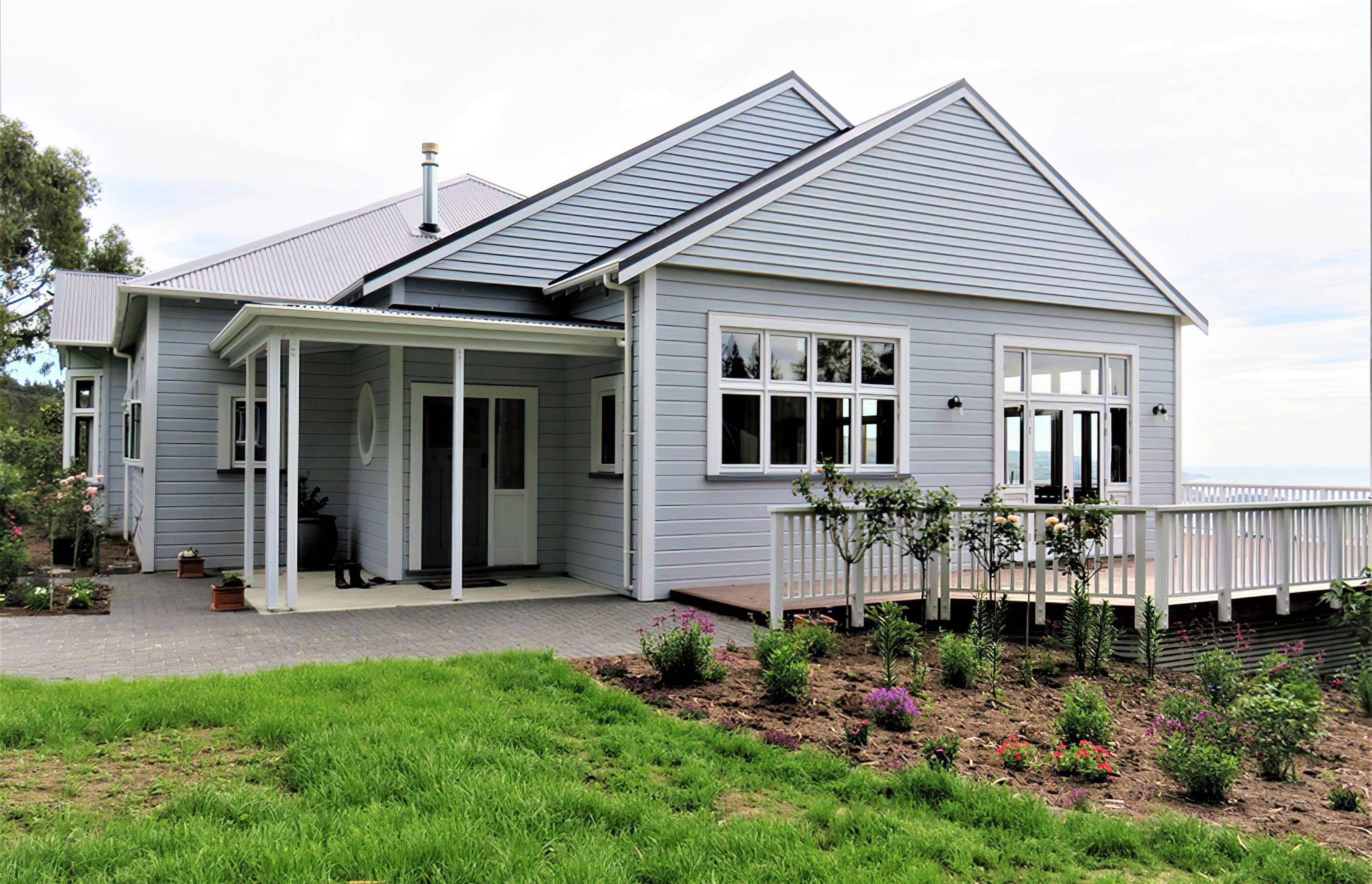 Wooden windows and kitchen joinery at this Blueskin Bay beach house by Ron Kirk joinery