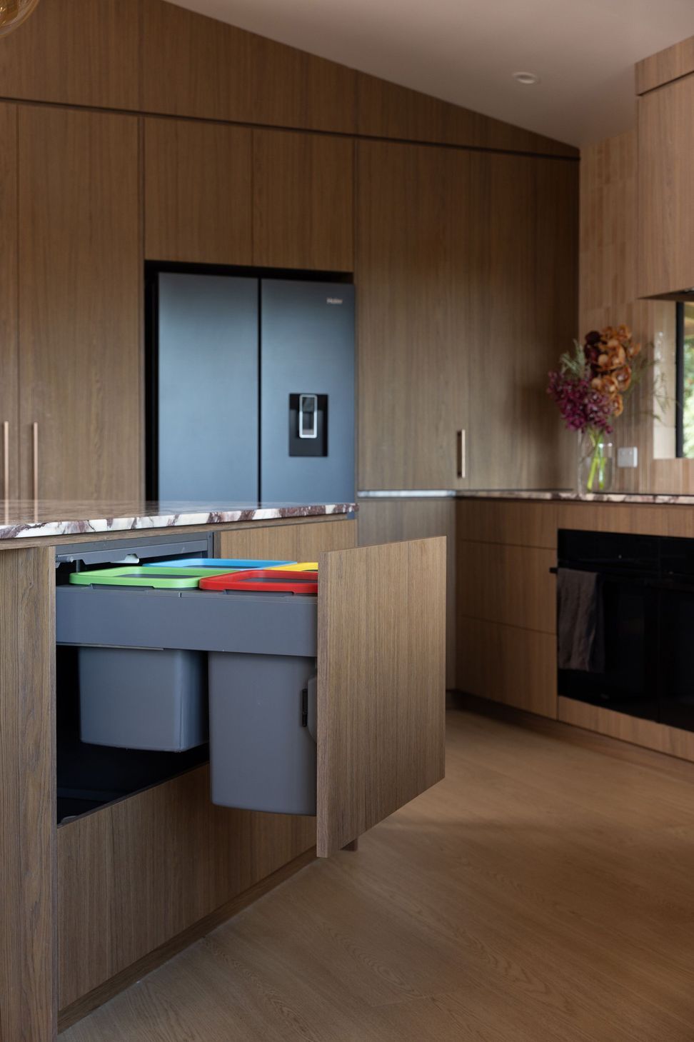 concealed-kitchen-bins-colour-coded-woodgrain-cabinetry-4.jpg