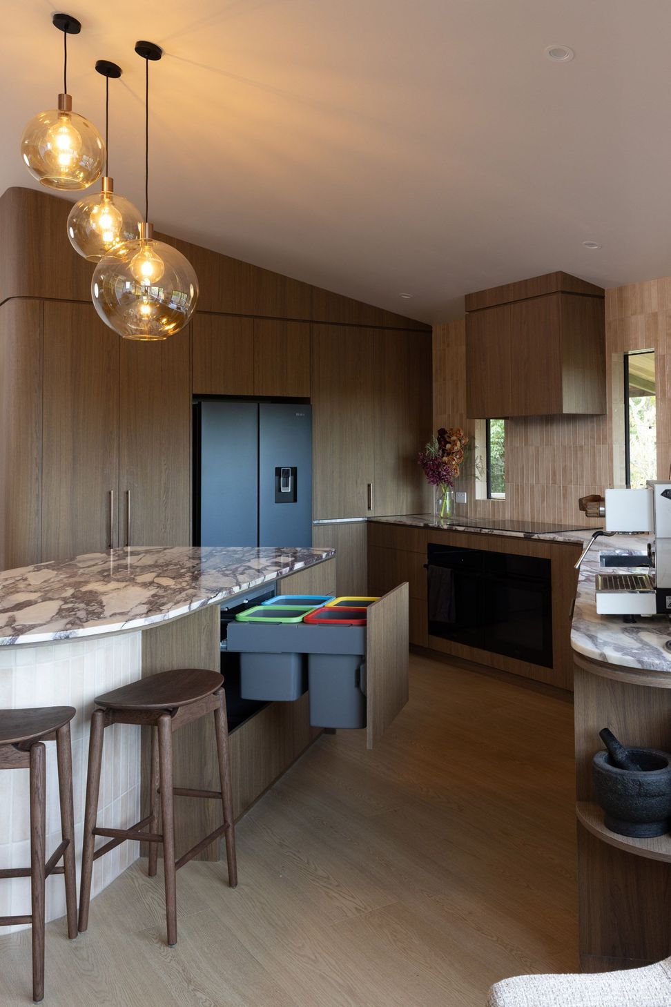concealed-kitchen-bins-colour-coded-woodgrain-cabinetry.jpg