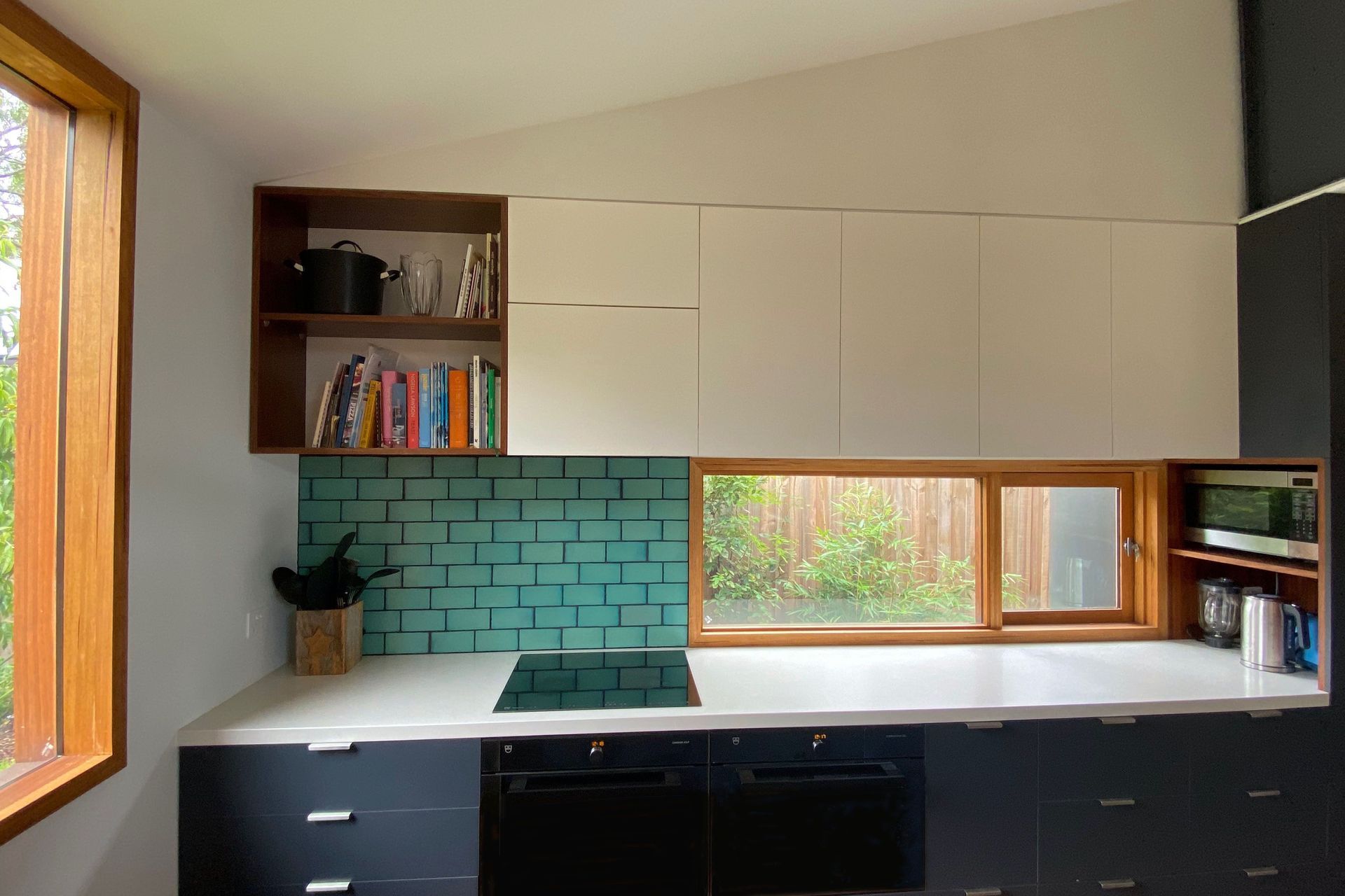The kitchen has good natural light and lots of storage