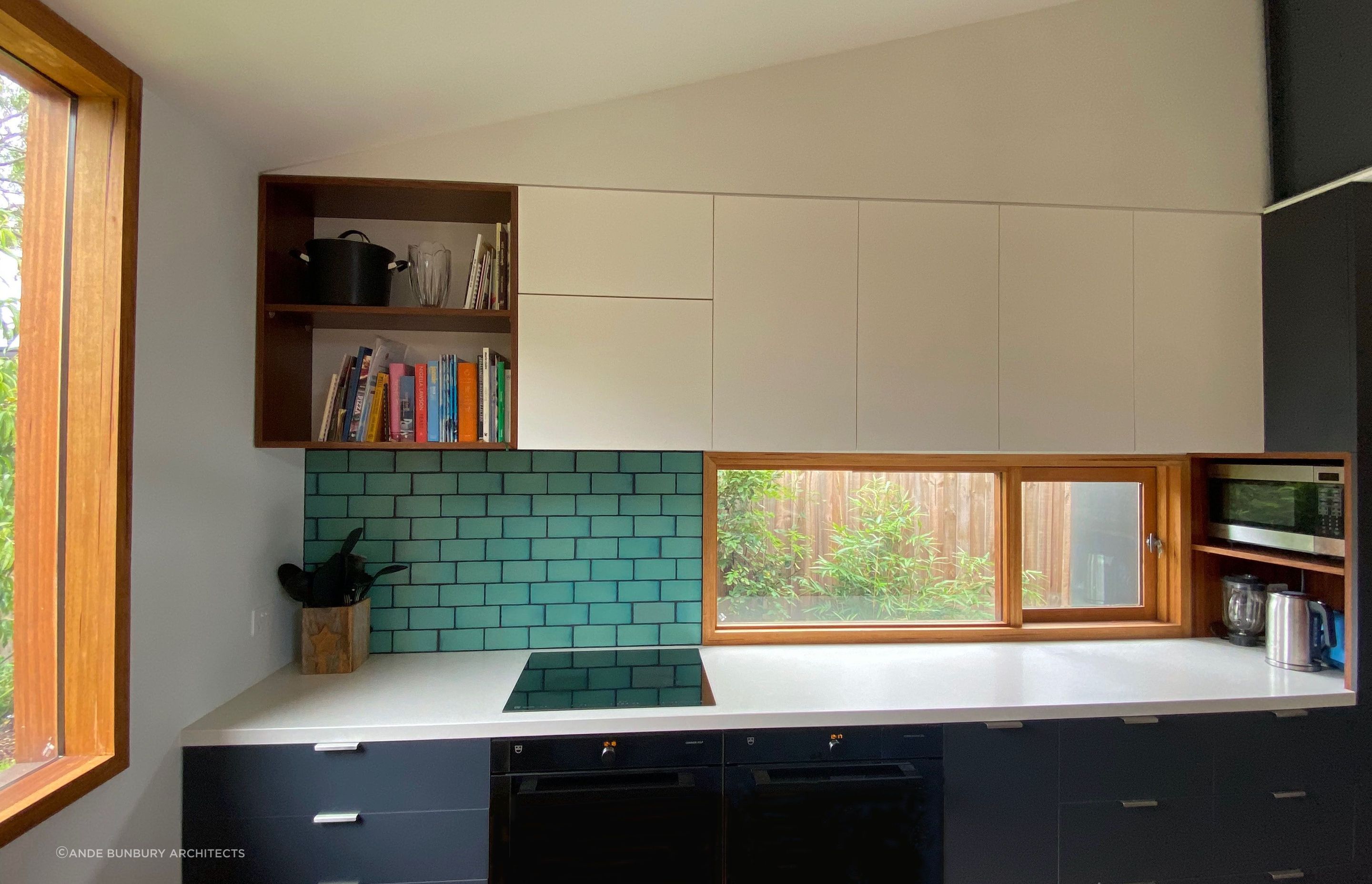 The kitchen has good natural light and lots of storage