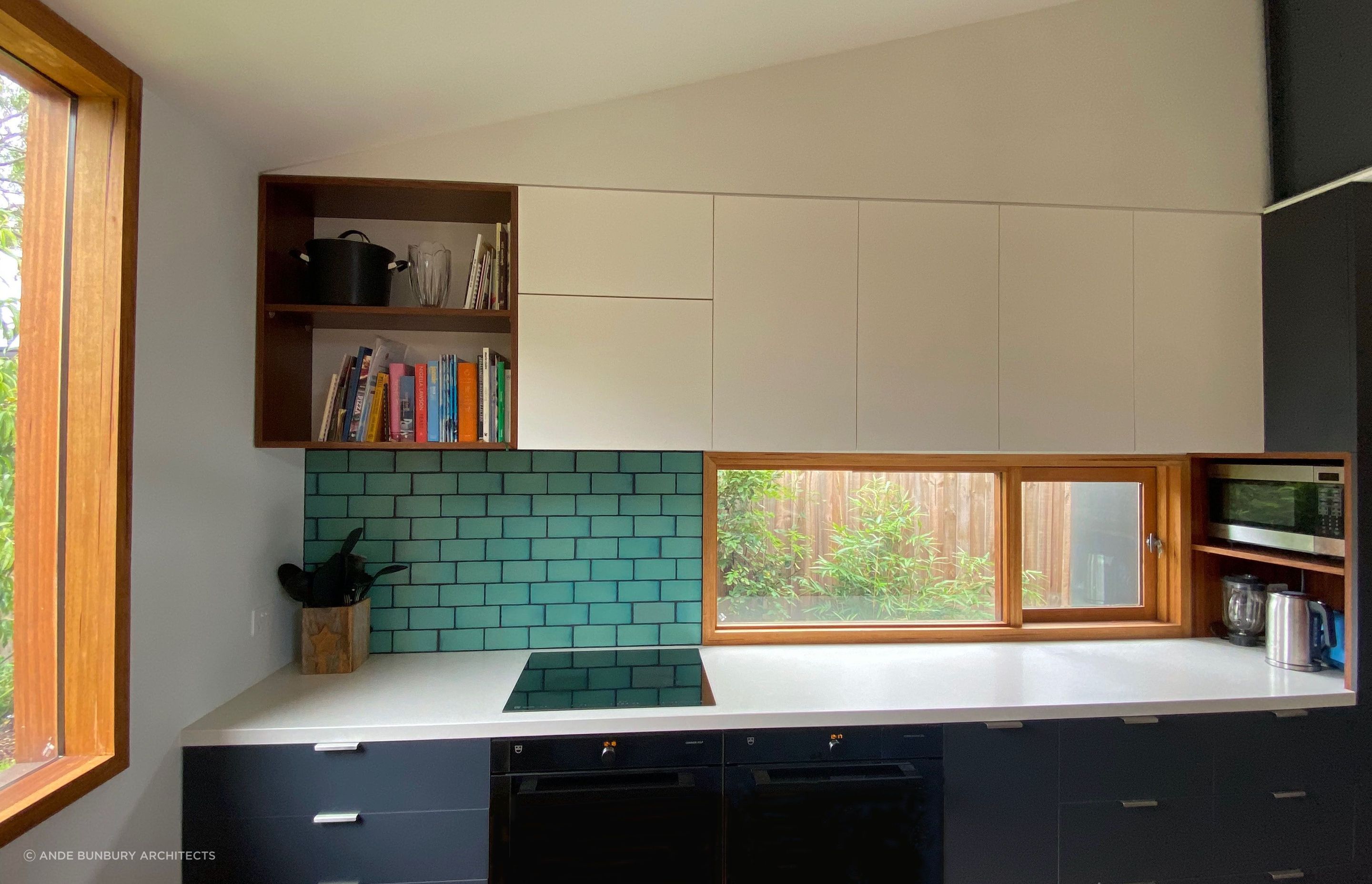 The kitchen has good natural light and lots of storage