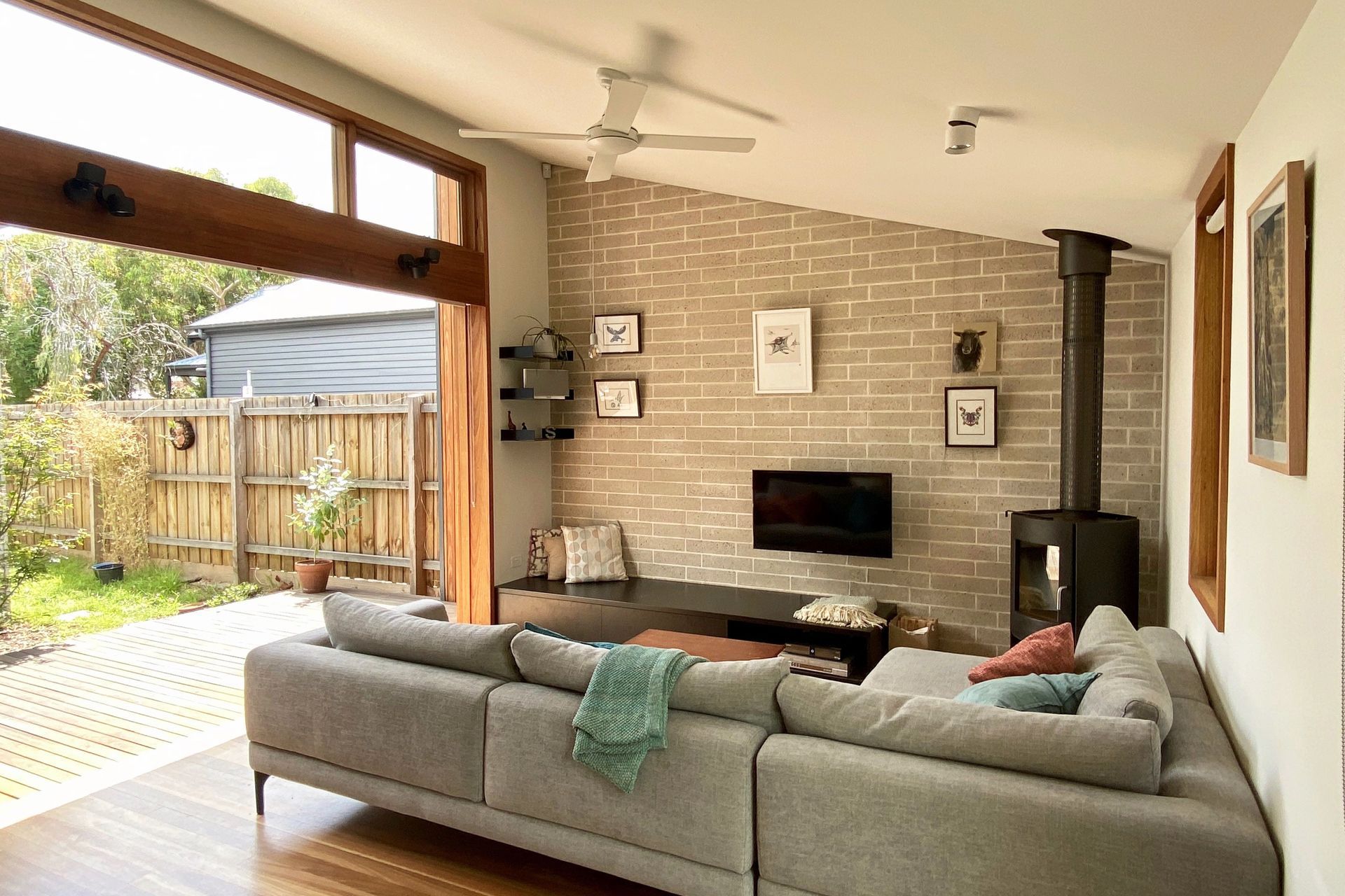High level windows and a north-facing deck in the courtyard bring lots of sun into the living room
