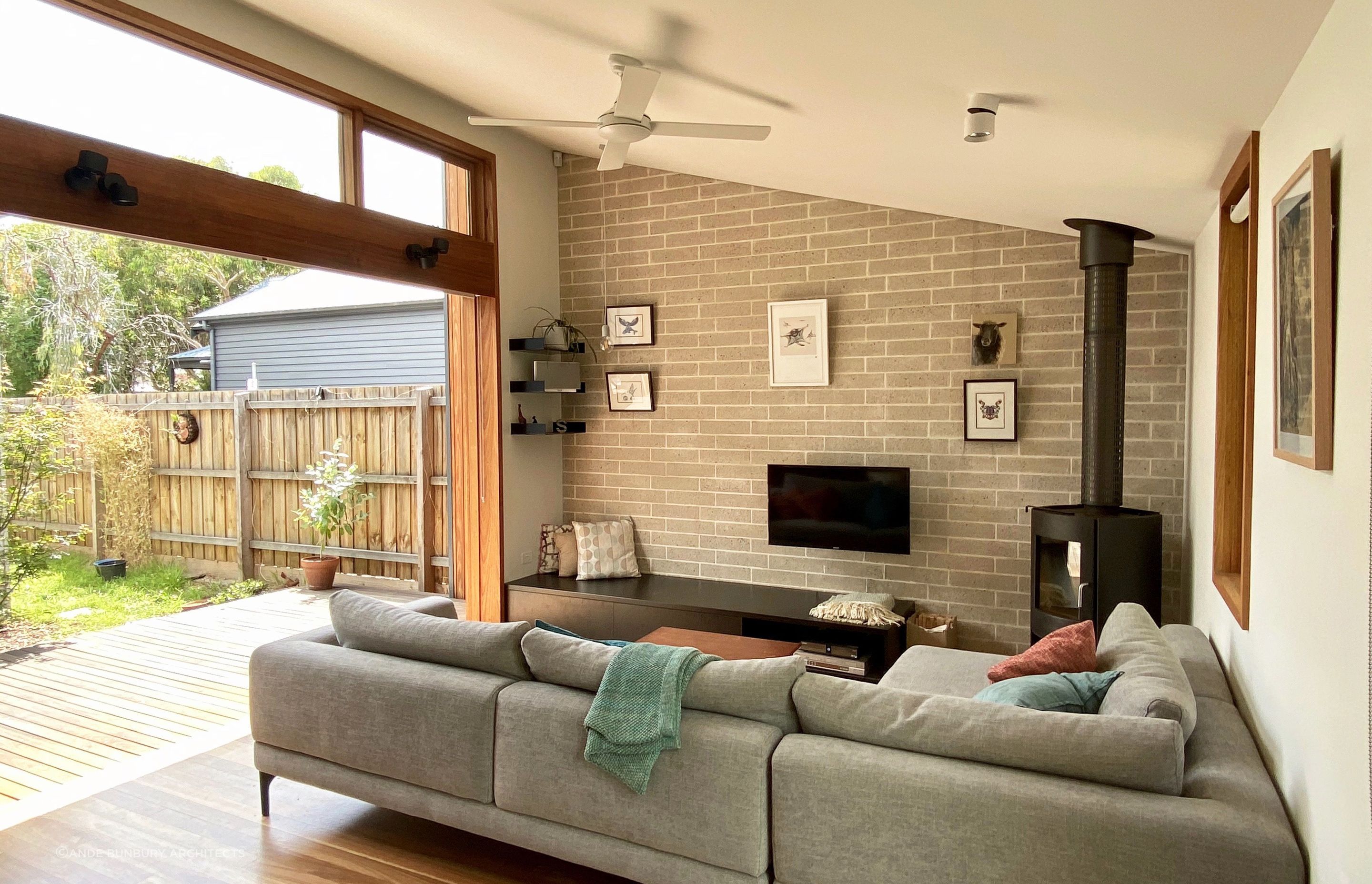 High level windows and a north-facing deck in the courtyard bring lots of sun into the living room