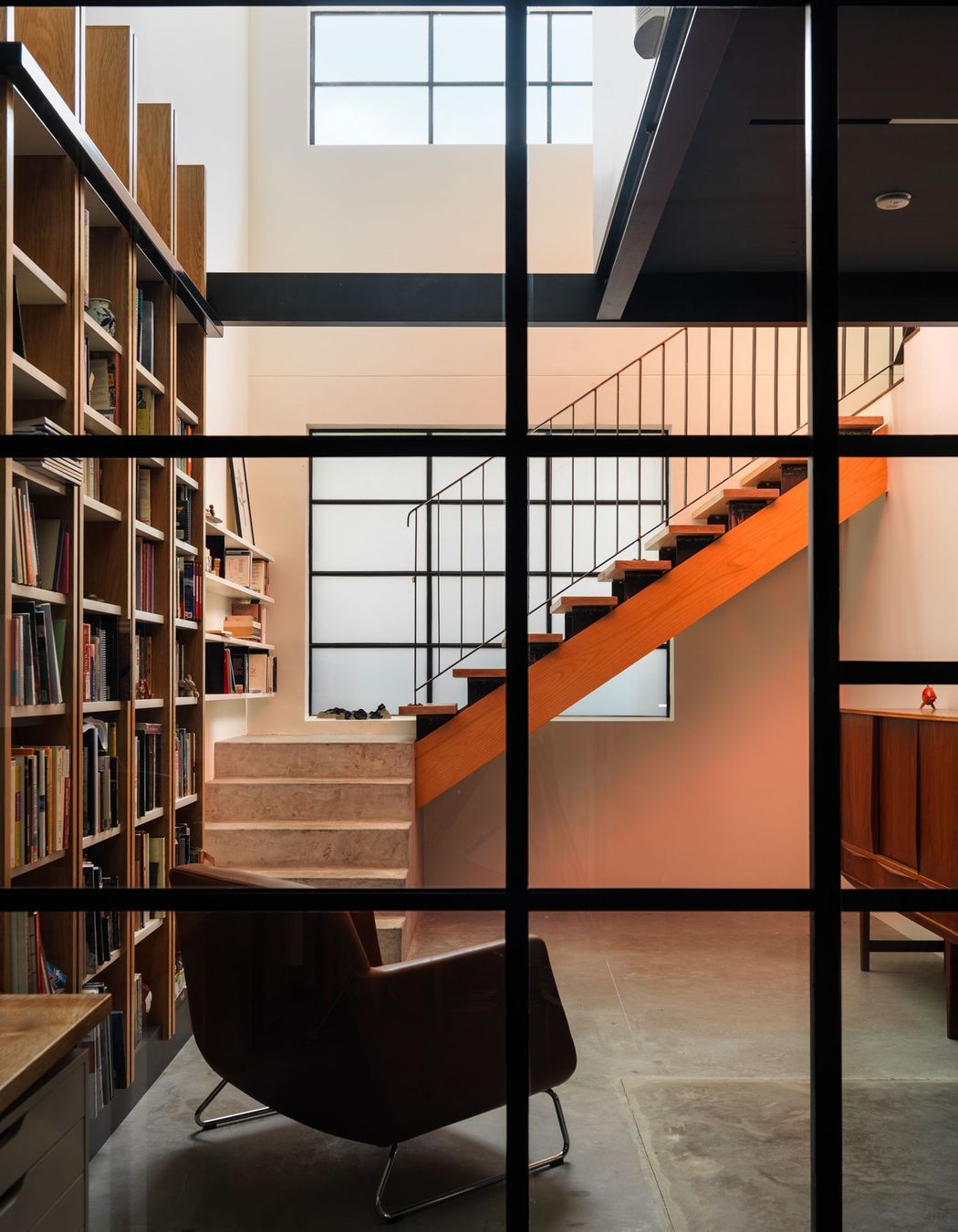 In built bookshelf, hardwood stairs