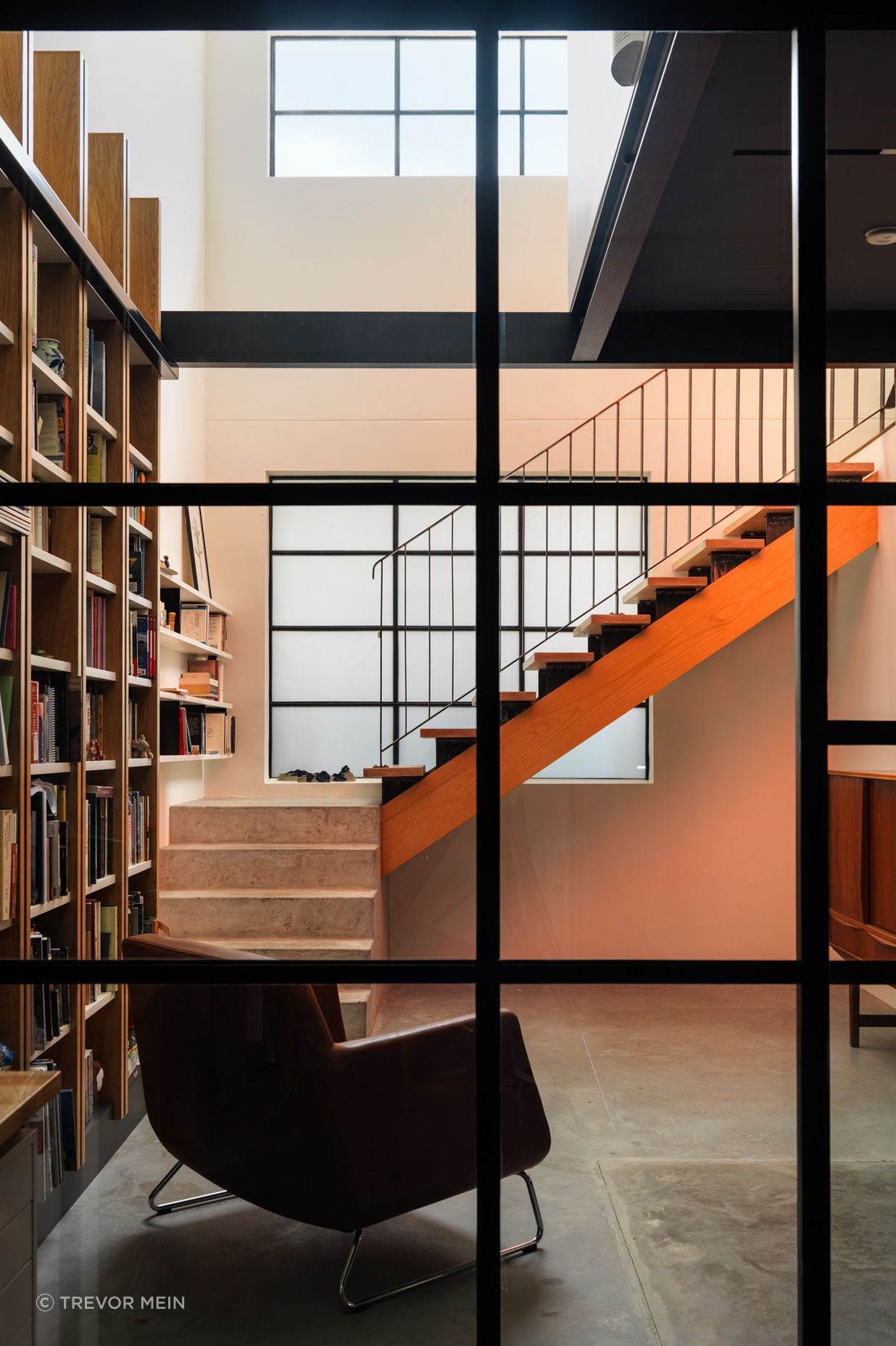 In built bookshelf, hardwood stairs