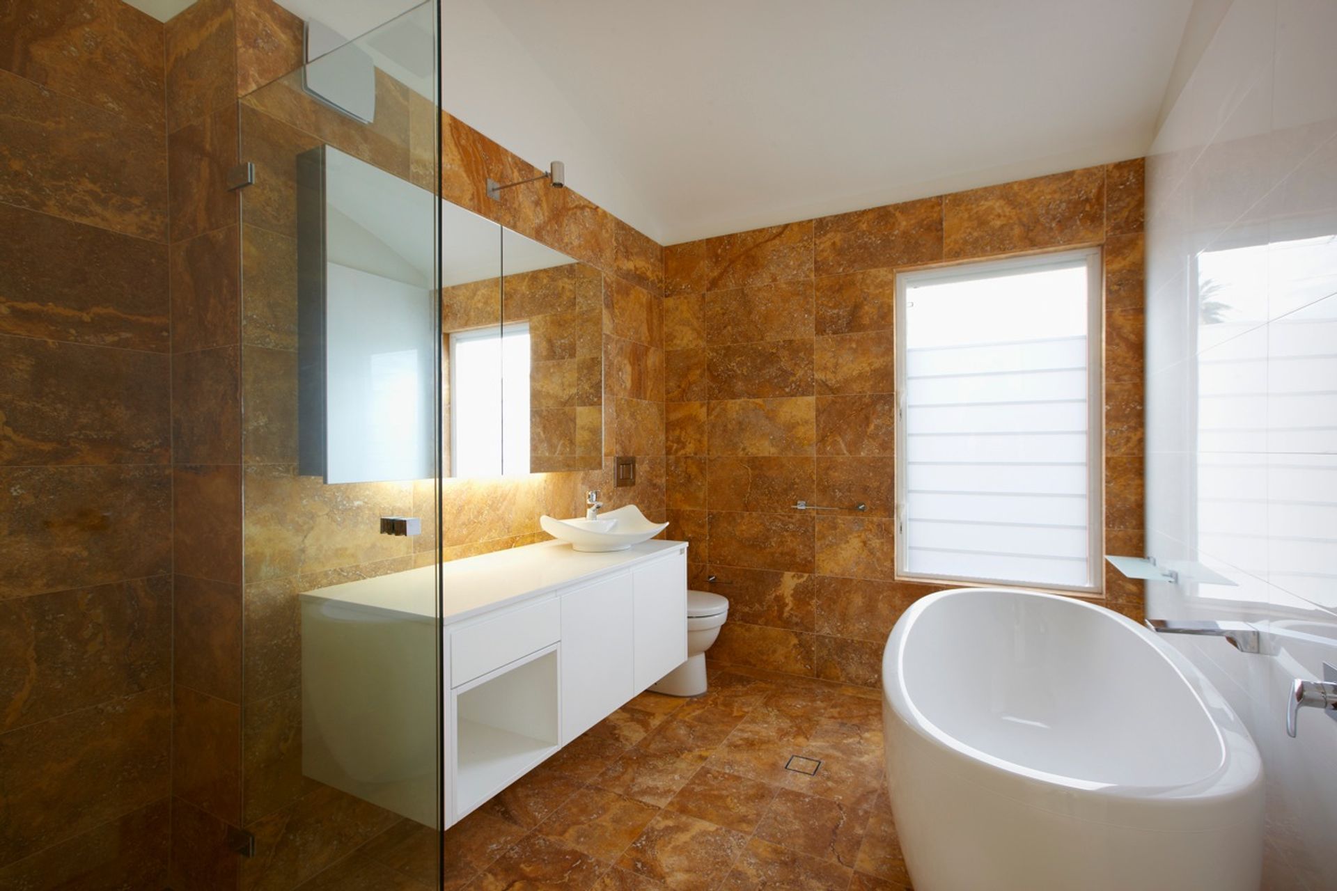 Travertine tiled bathroom