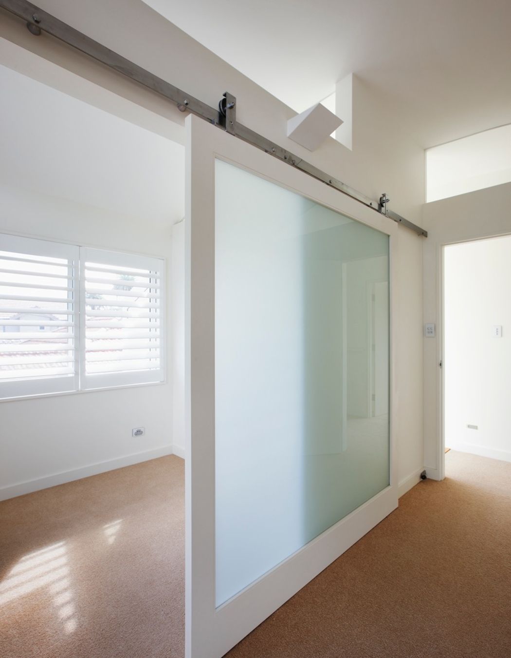 Large glazed sliding door to main bedroom study