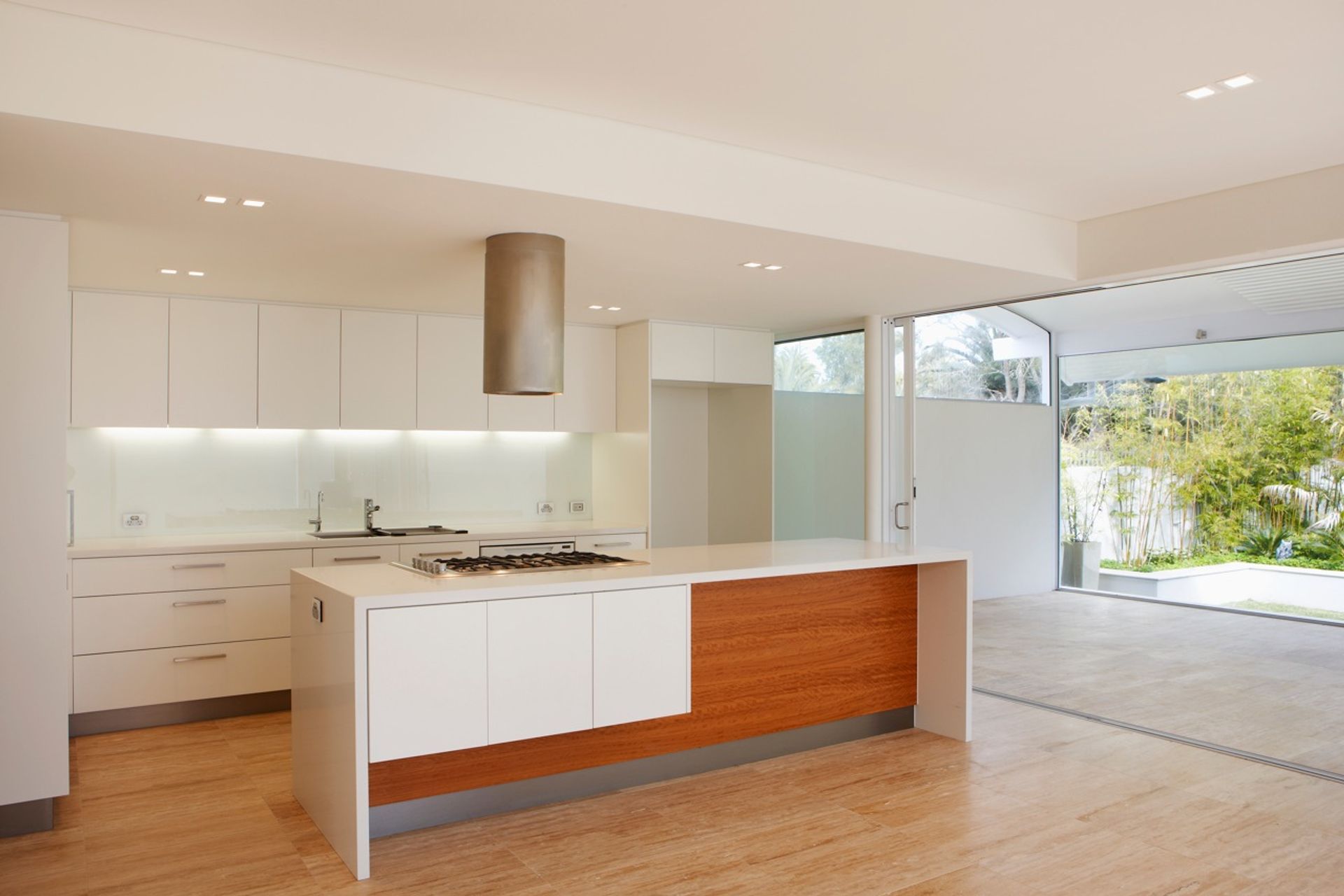 Custom design joinery to kitchen, covered terrace beyond