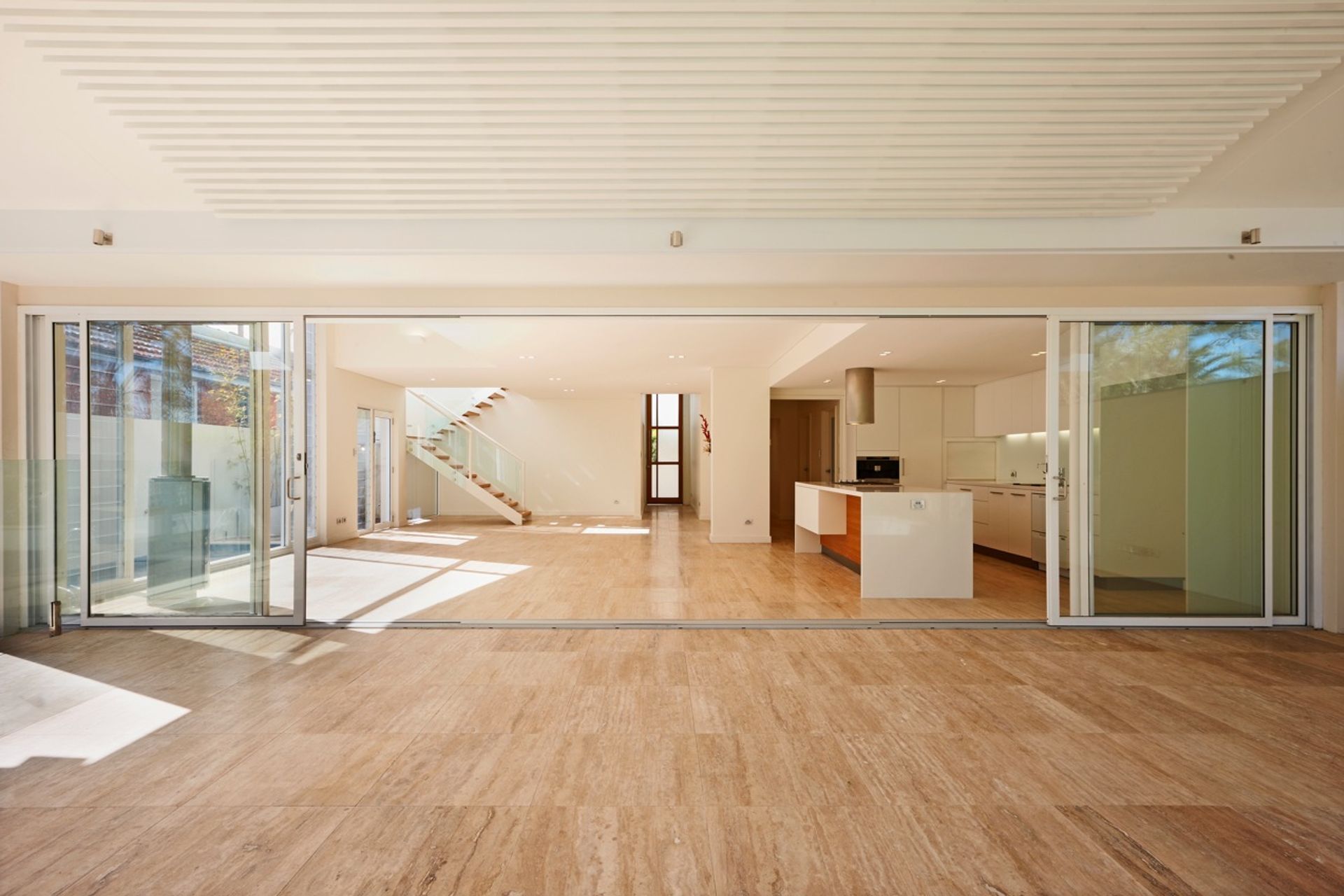 Kitchen, dining and living area- feature stair in background