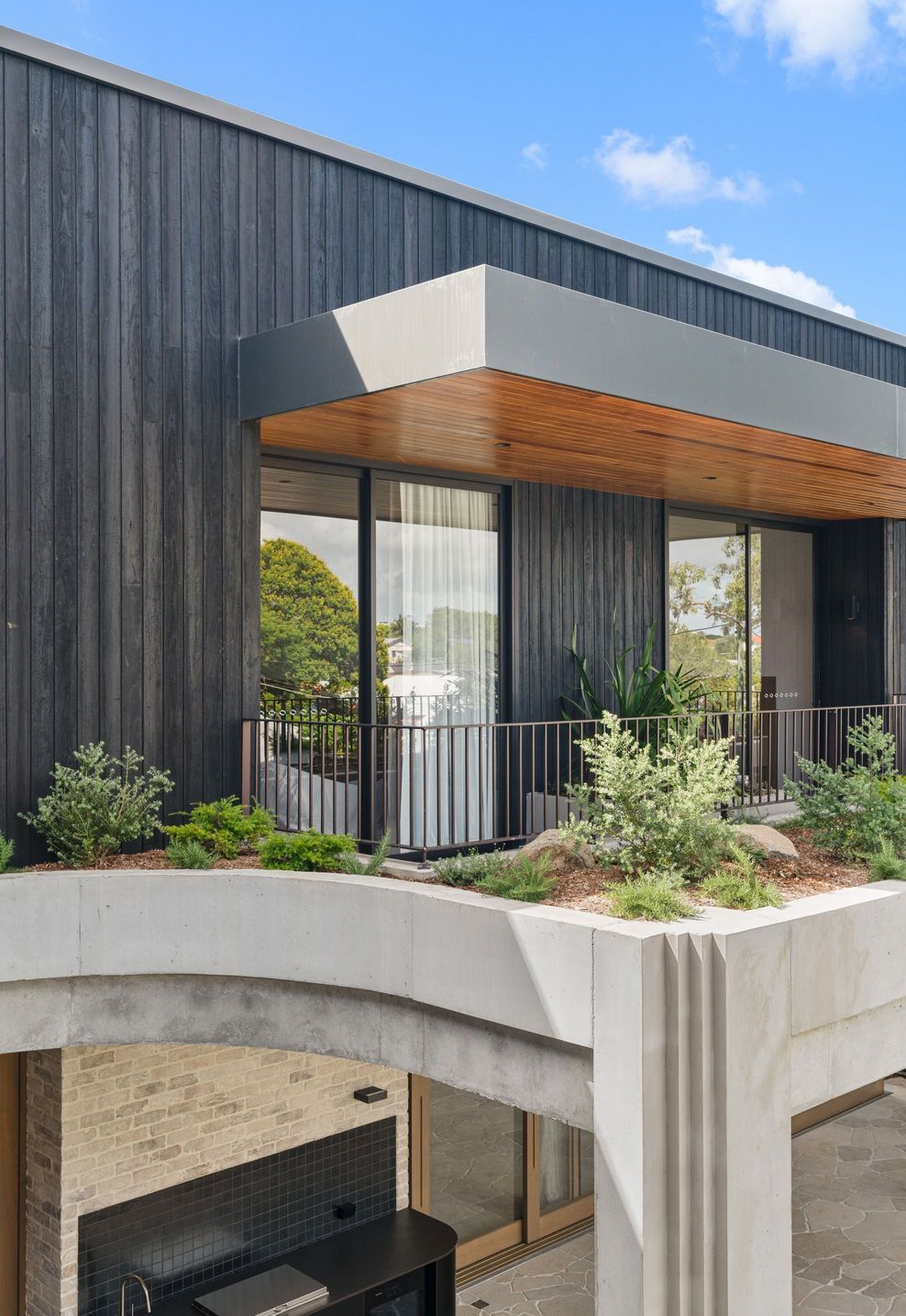 Planted edges blur the line between terrace and garden on the upper level.