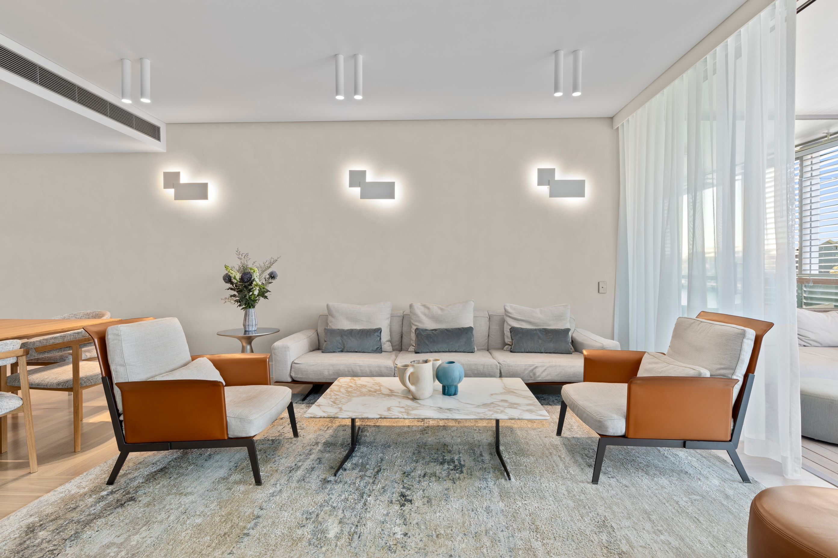 The Living area showing new lighting and limewash texture finish walls.