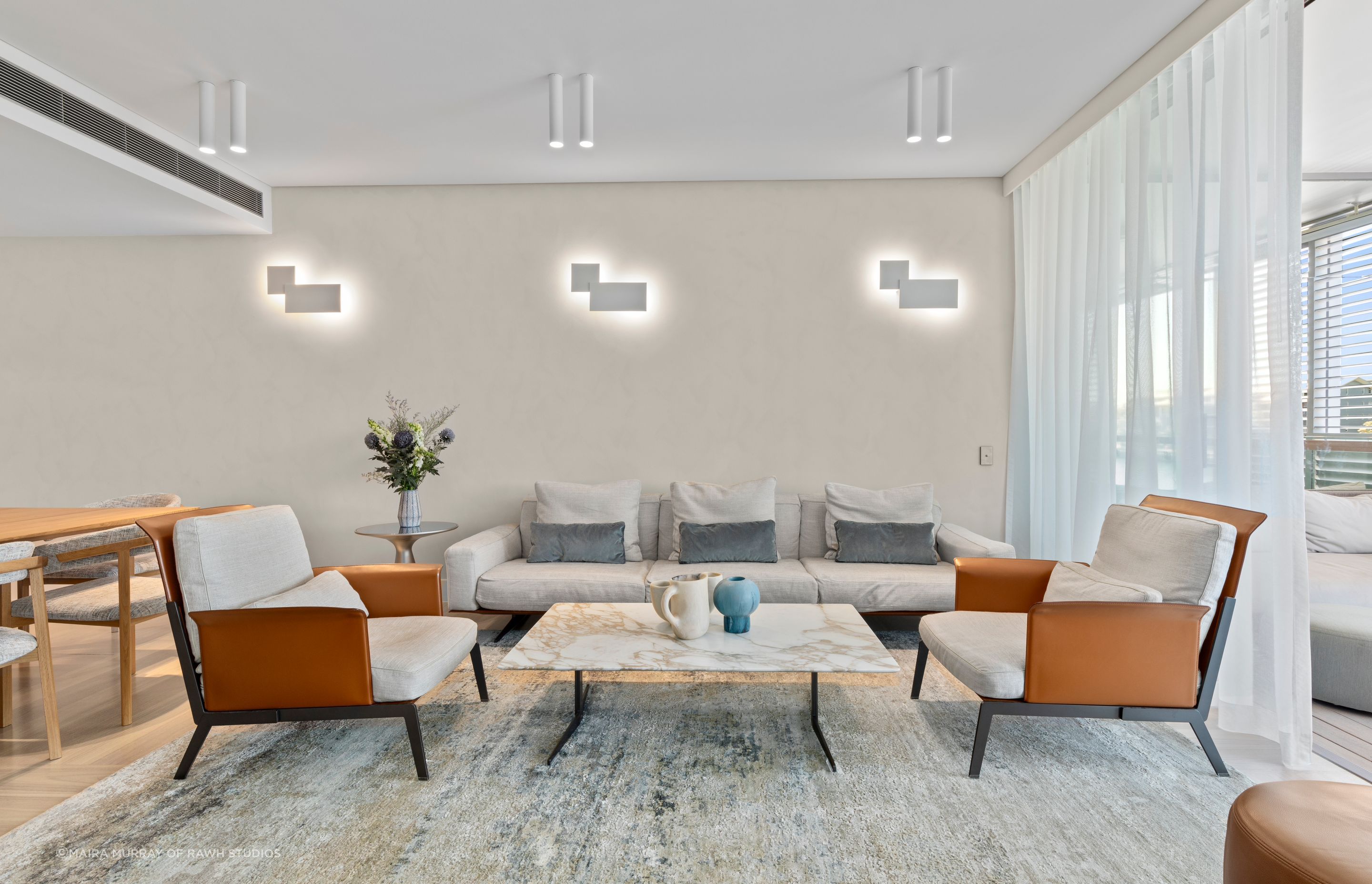 The Living area showing new lighting and limewash texture finish walls.