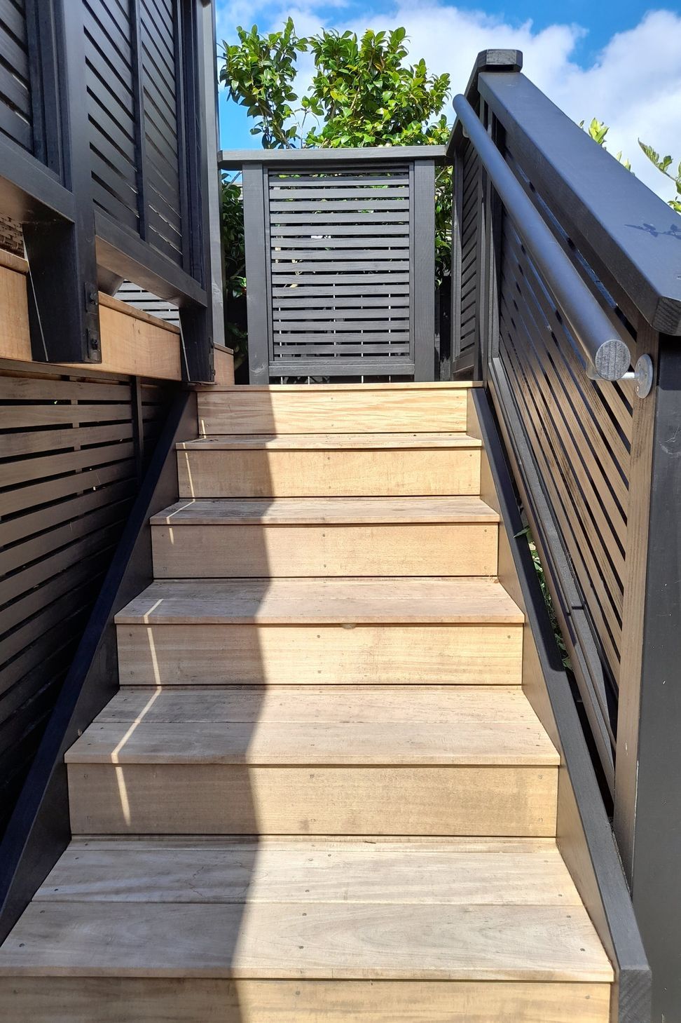 The new stairs leading onto the deck have a safety handrail for ease of use