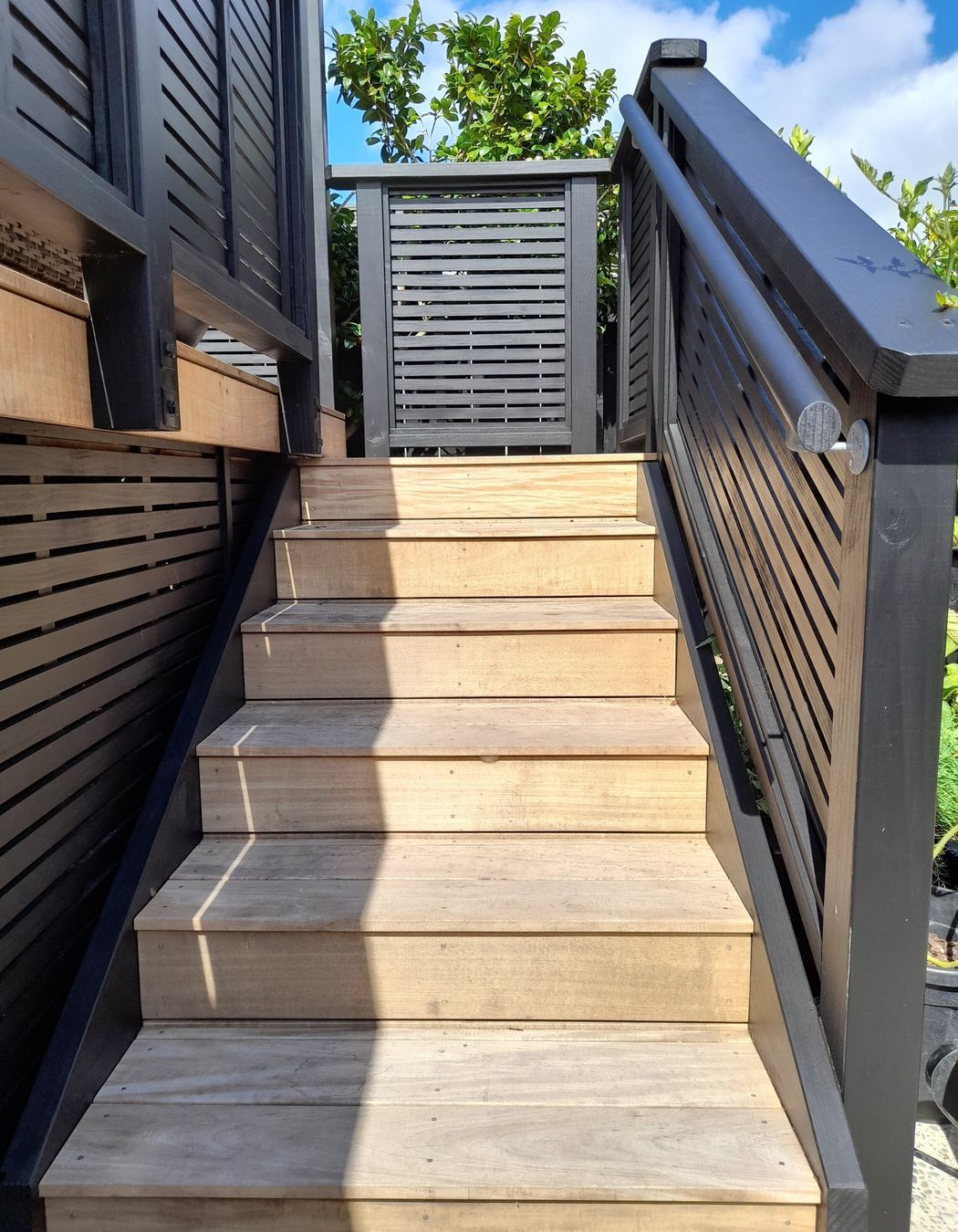 The new stairs leading onto the deck have a safety handrail for ease of use