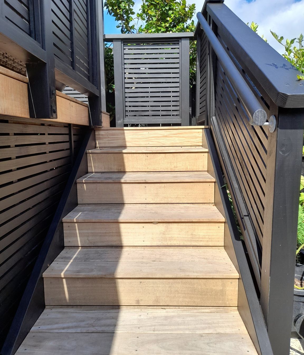 The new stairs leading onto the deck have a safety handrail for ease of use