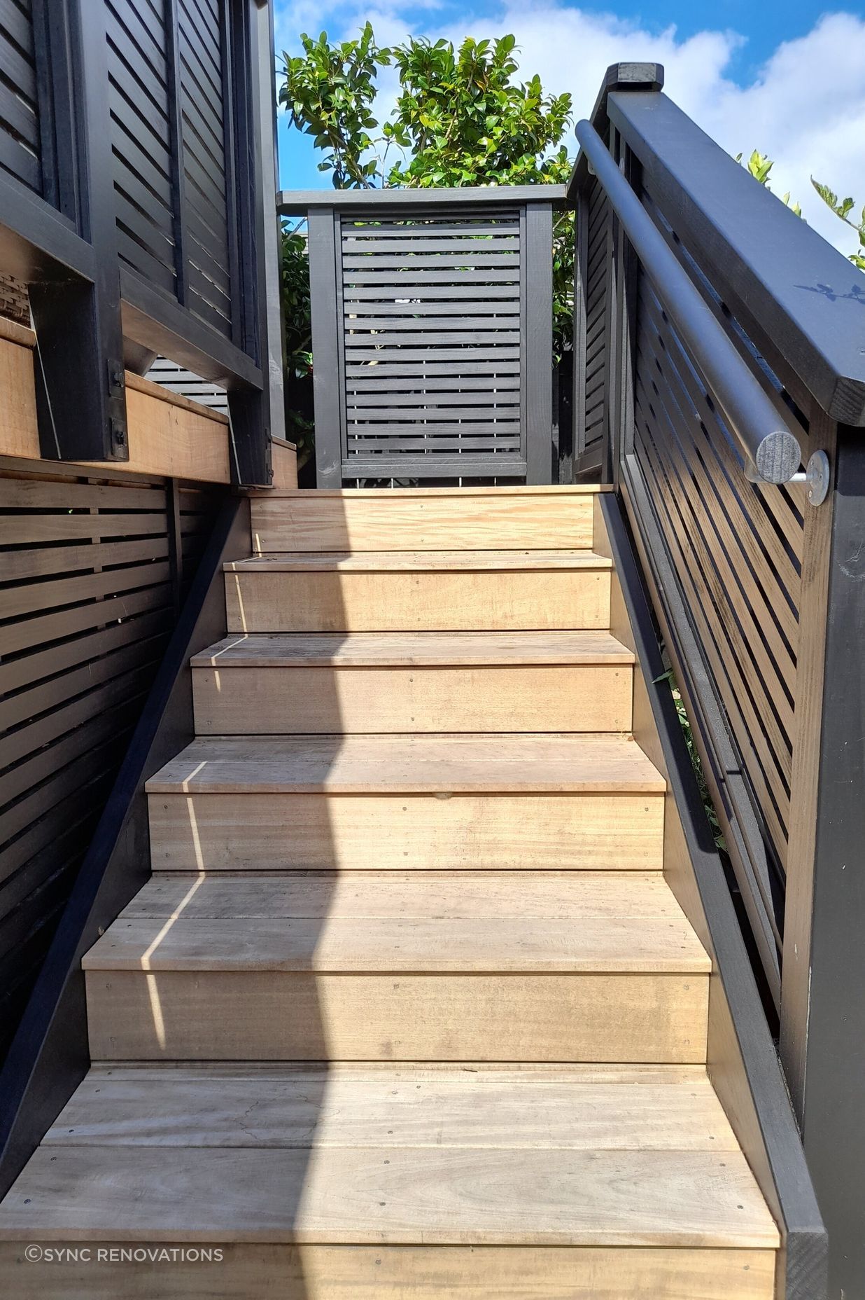 The new stairs leading onto the deck have a safety handrail for ease of use