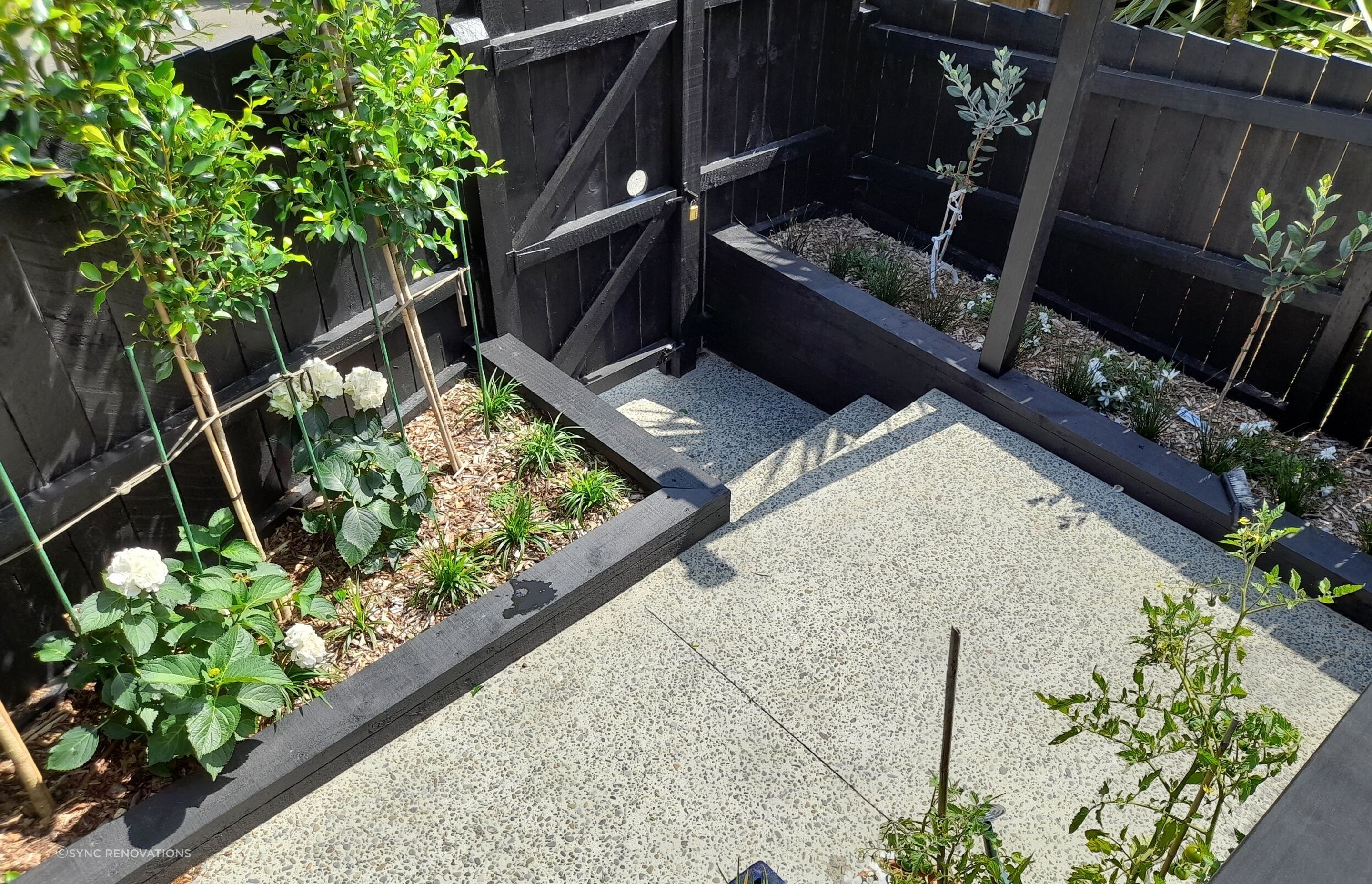 The finished path and gardens provide low maintenance and easy access to the area