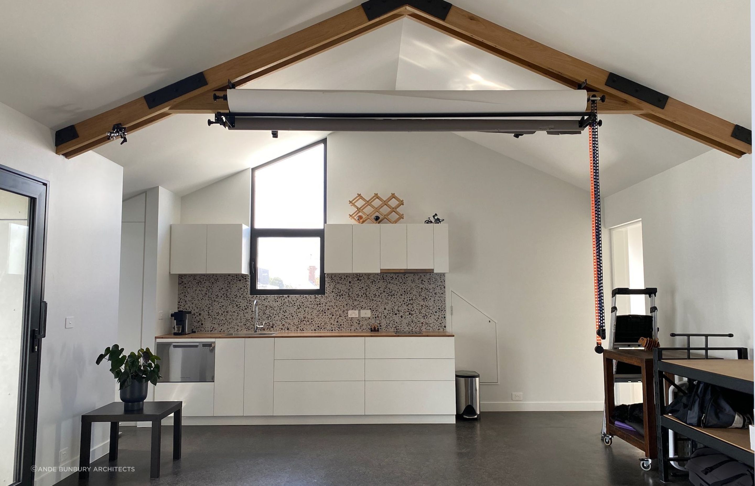 Exposed timber trusses provide mountings for photography equipment