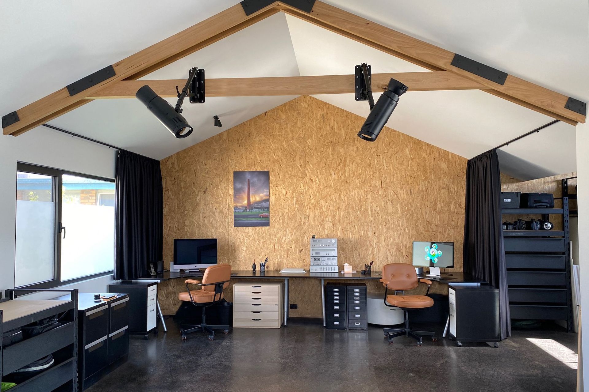 Photography studio with exposed structural insulated panel walls