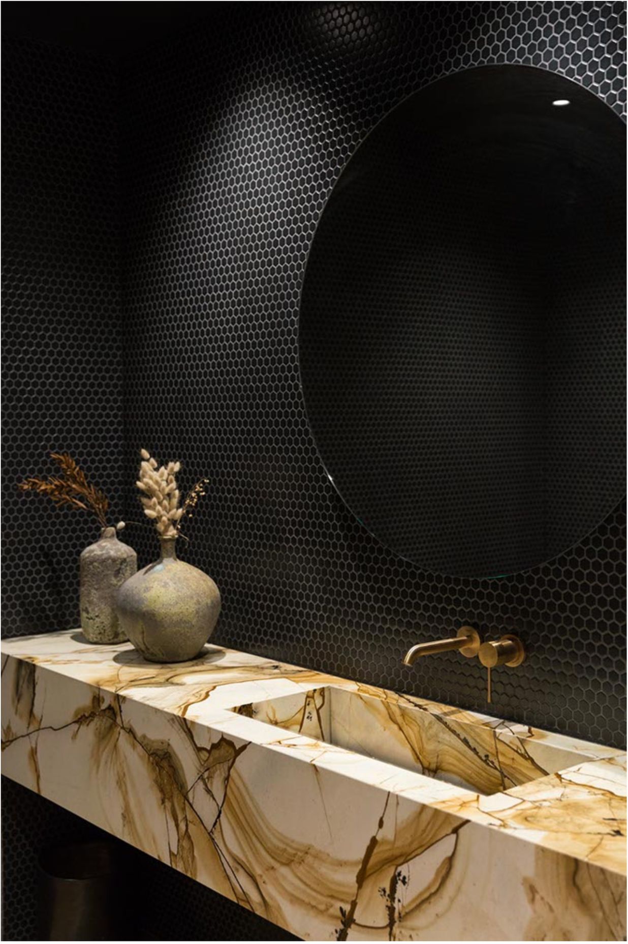 Bespoke handcrafted integrated hand basin and vanity crafted by our artisan stone specialists, Granite Workshop
