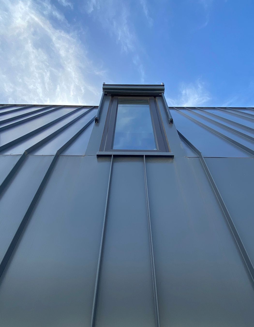 Durable metal cladding was used for the upper storey extension