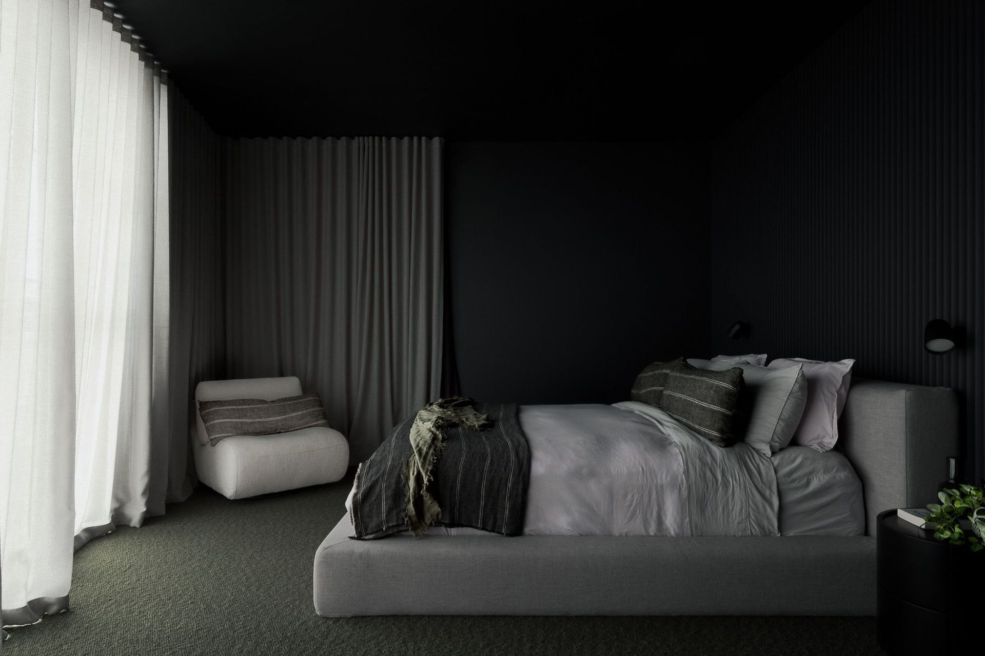 0042 Residence - Bedroom. Main bedroom with dark walls, layered linen and floor to ceiling curtains.