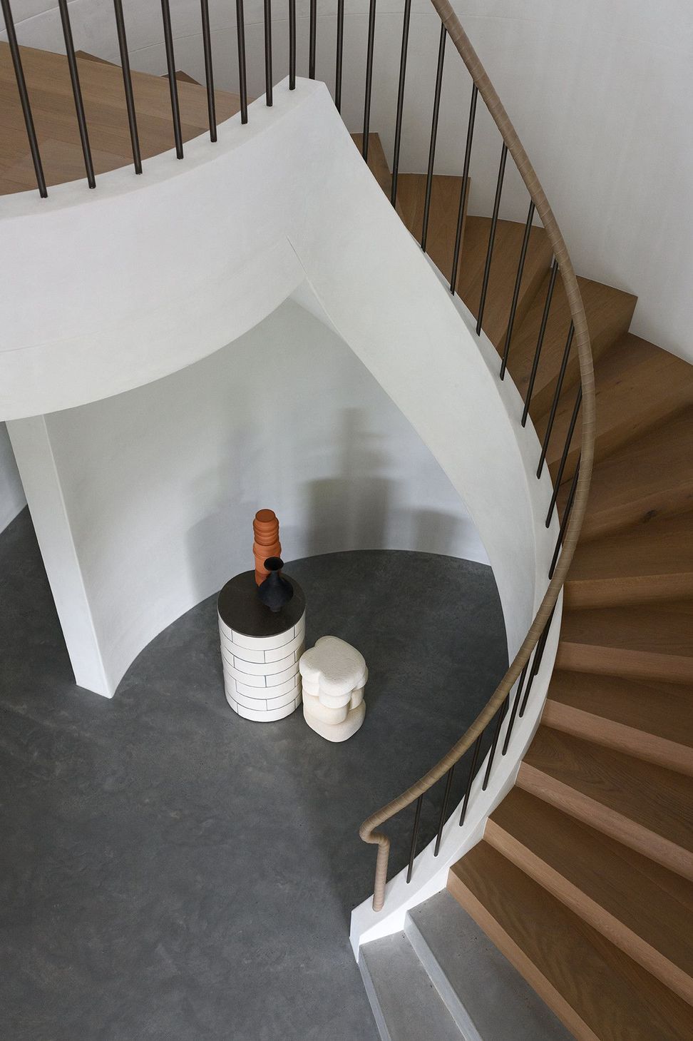 Villa Solare - Staircase. Spiral stair wrapping around a sculptural void.