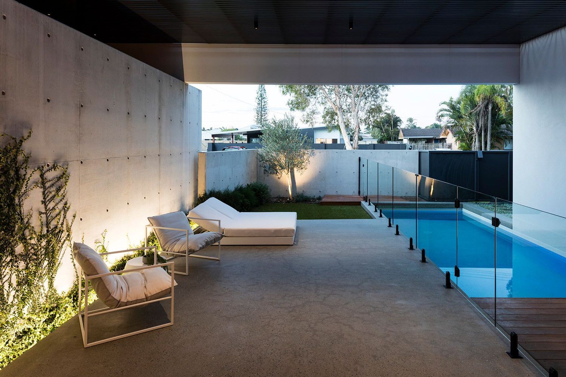 Morrison Residence - Pool. Pool and outdoor lounge at dusk.
