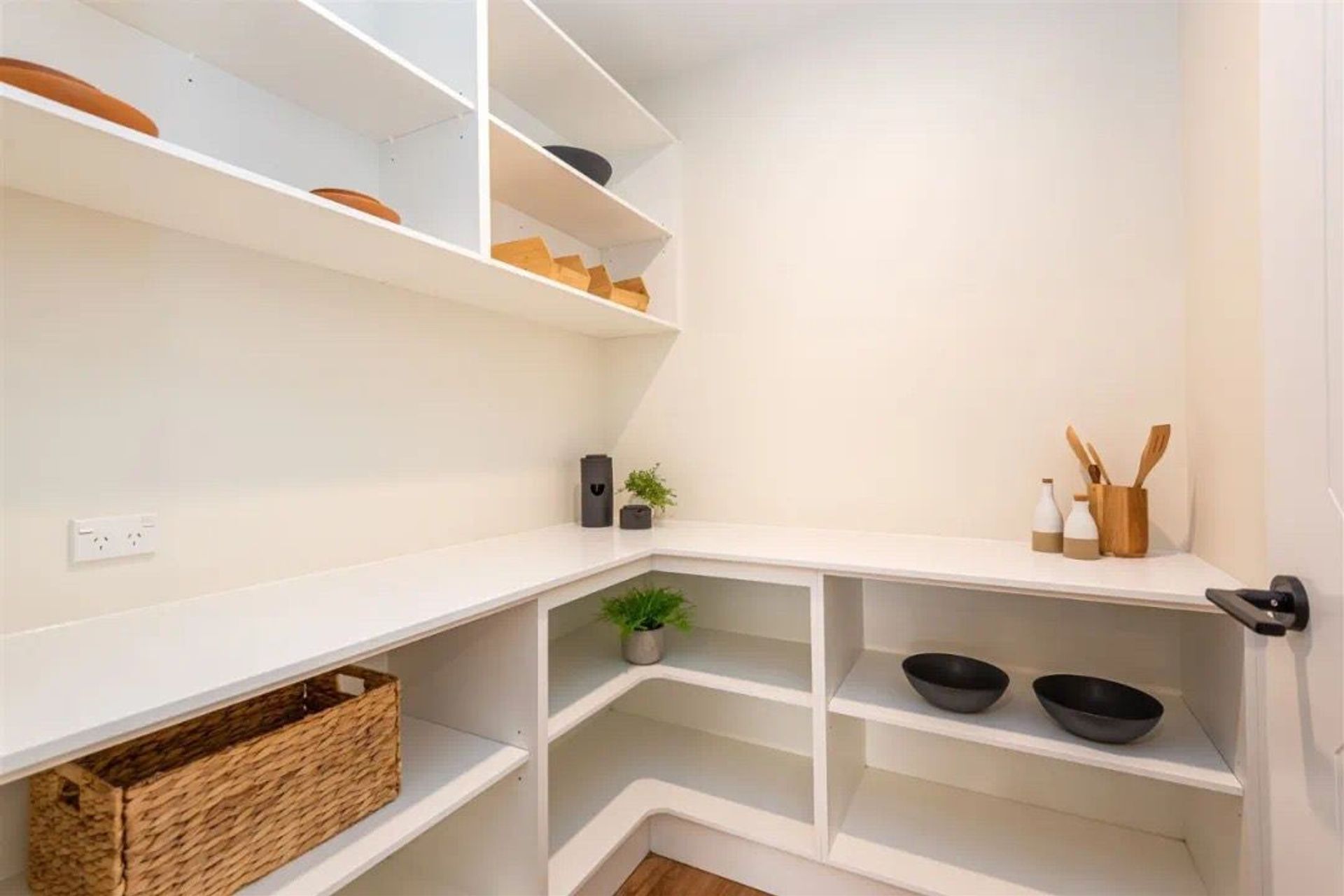 The walk in pantry is always a relatively small area at home. Then the open shelves are a better choice for saving space.  Do not need to considering the space for door opening. All white color scheme makes it clean.