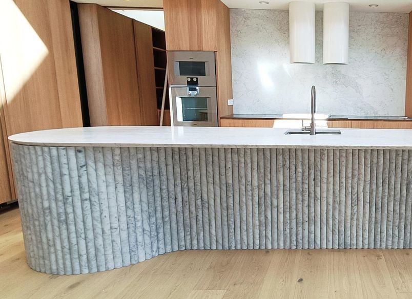 Damn Good Tiling - kitchen island flute marble tile