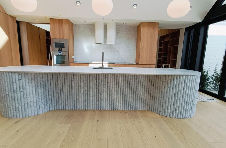 Damn Good Tiling - kitchen island flute marble tile