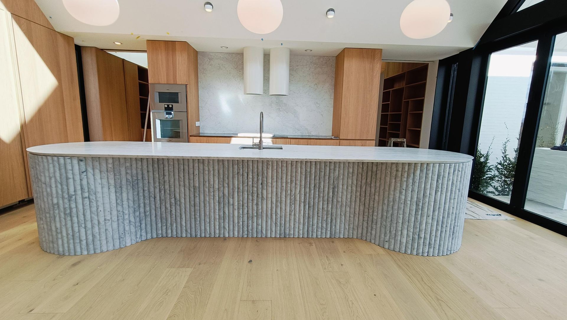 Damn Good Tiling - kitchen island flute marble tile banner