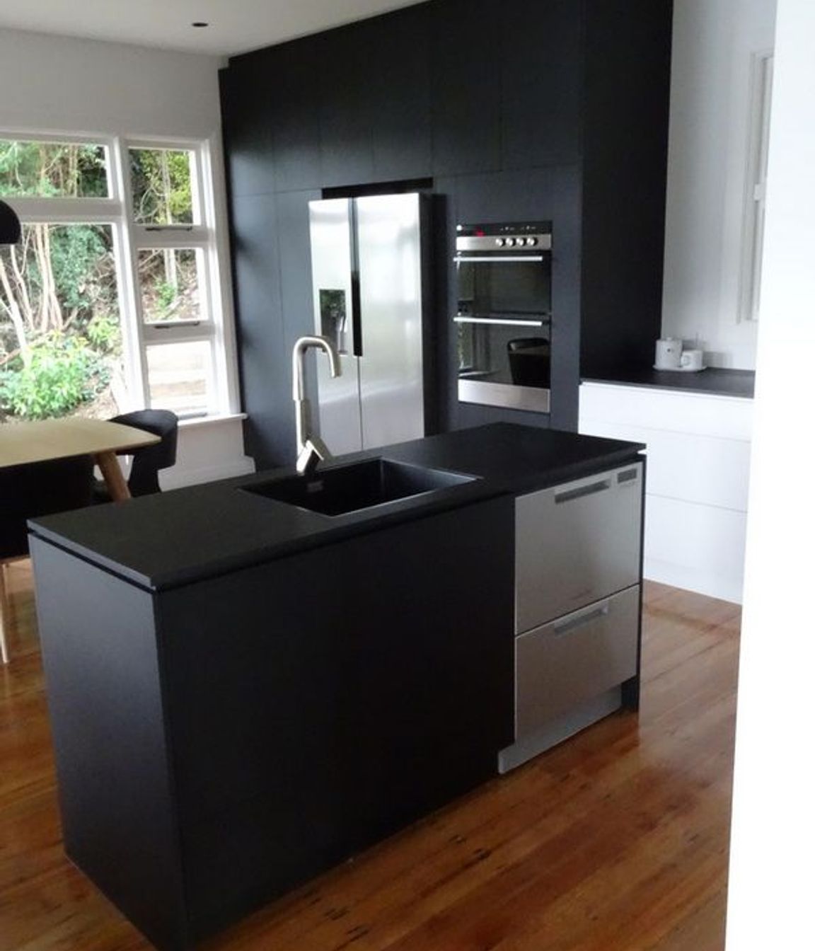  A mix of mat black and chrome makes this kitchen sleek stylish and modern joinery