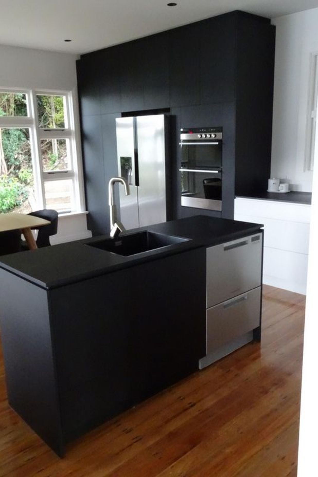  A mix of mat black and chrome makes this kitchen sleek stylish and modern joinery