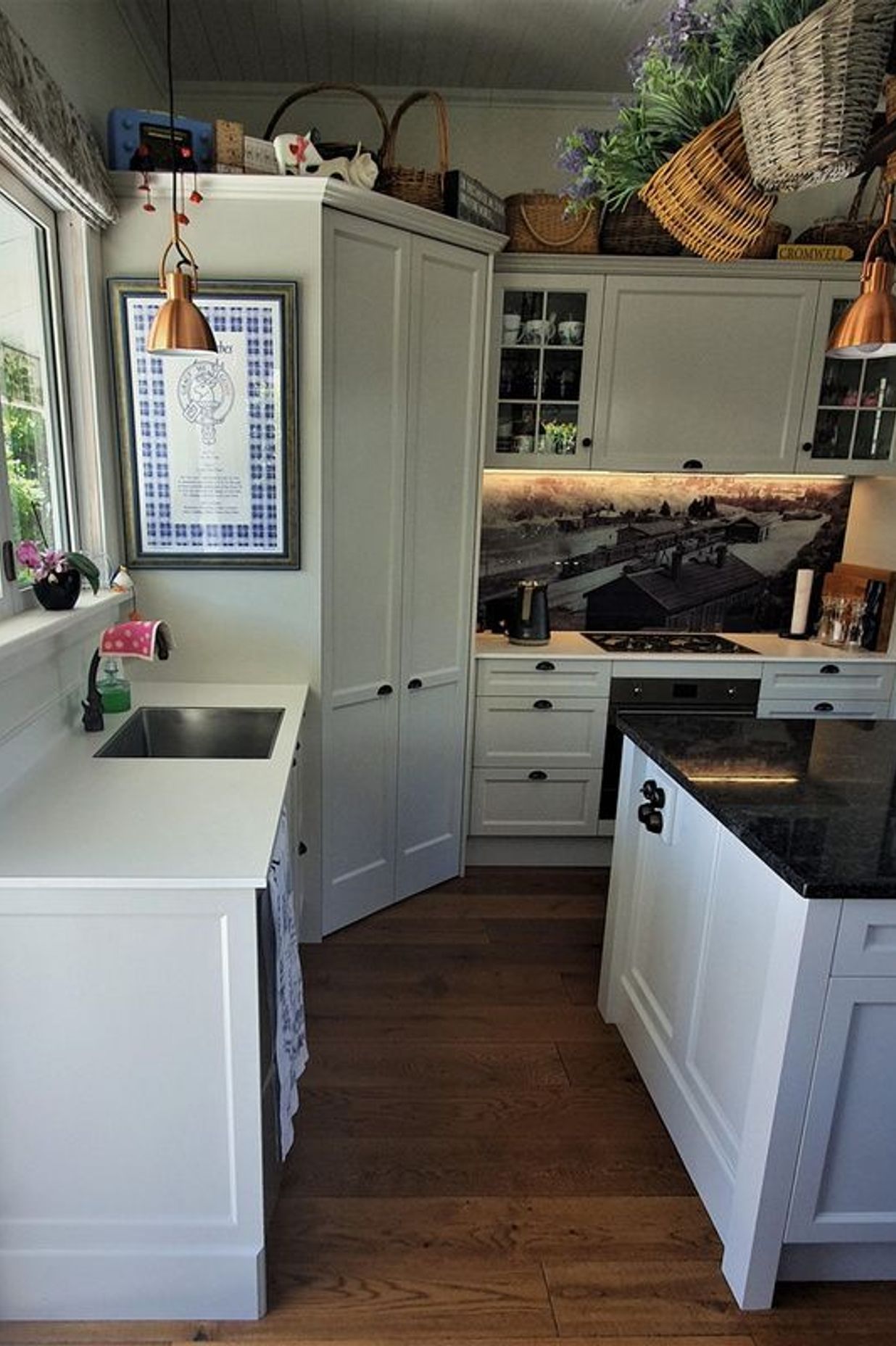 Artwork, lighting and the custom splash back add personal touches