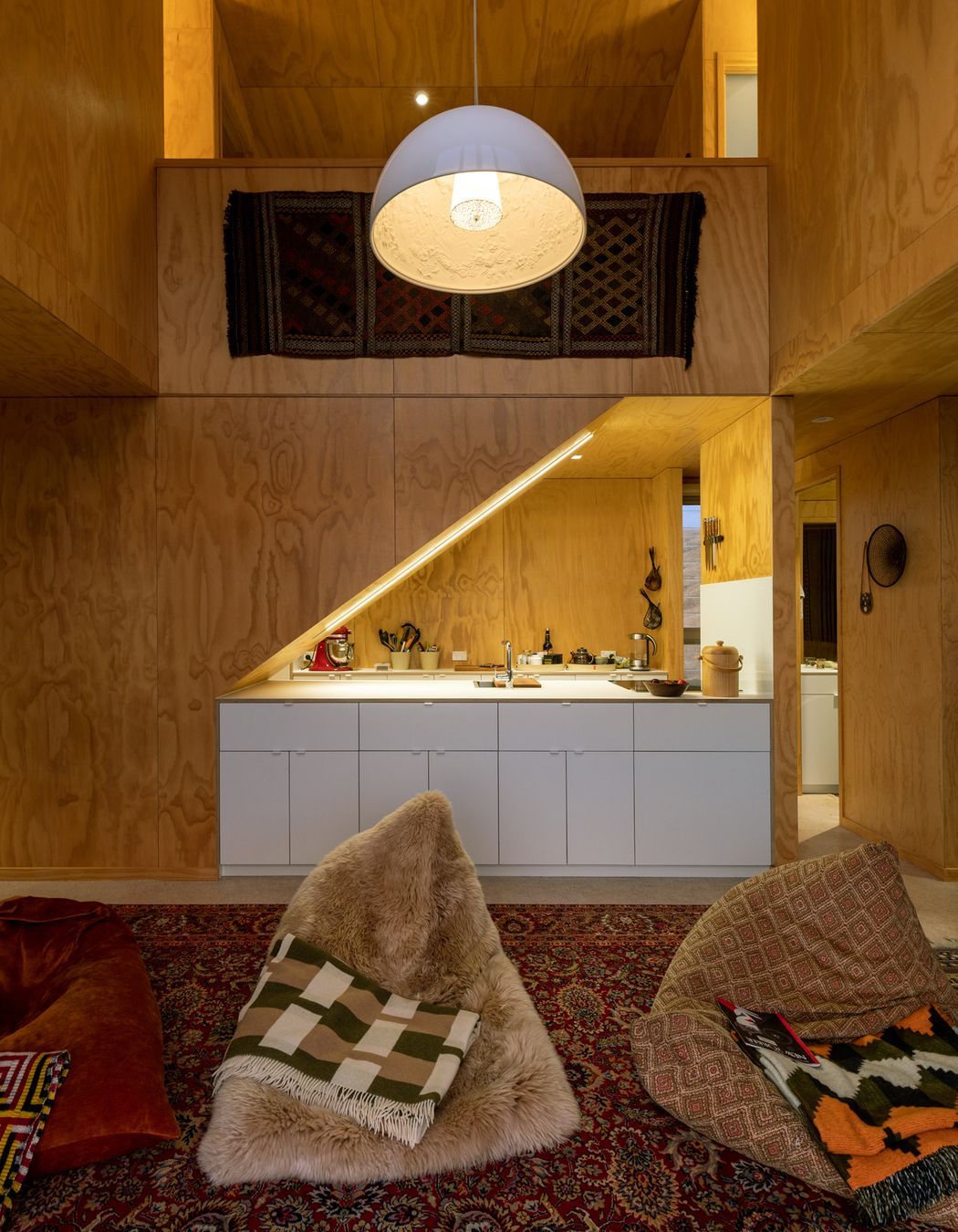 While the natural timber creates a cosiness, the loftiness of the living area prevents the space from feeling claustrophobic.