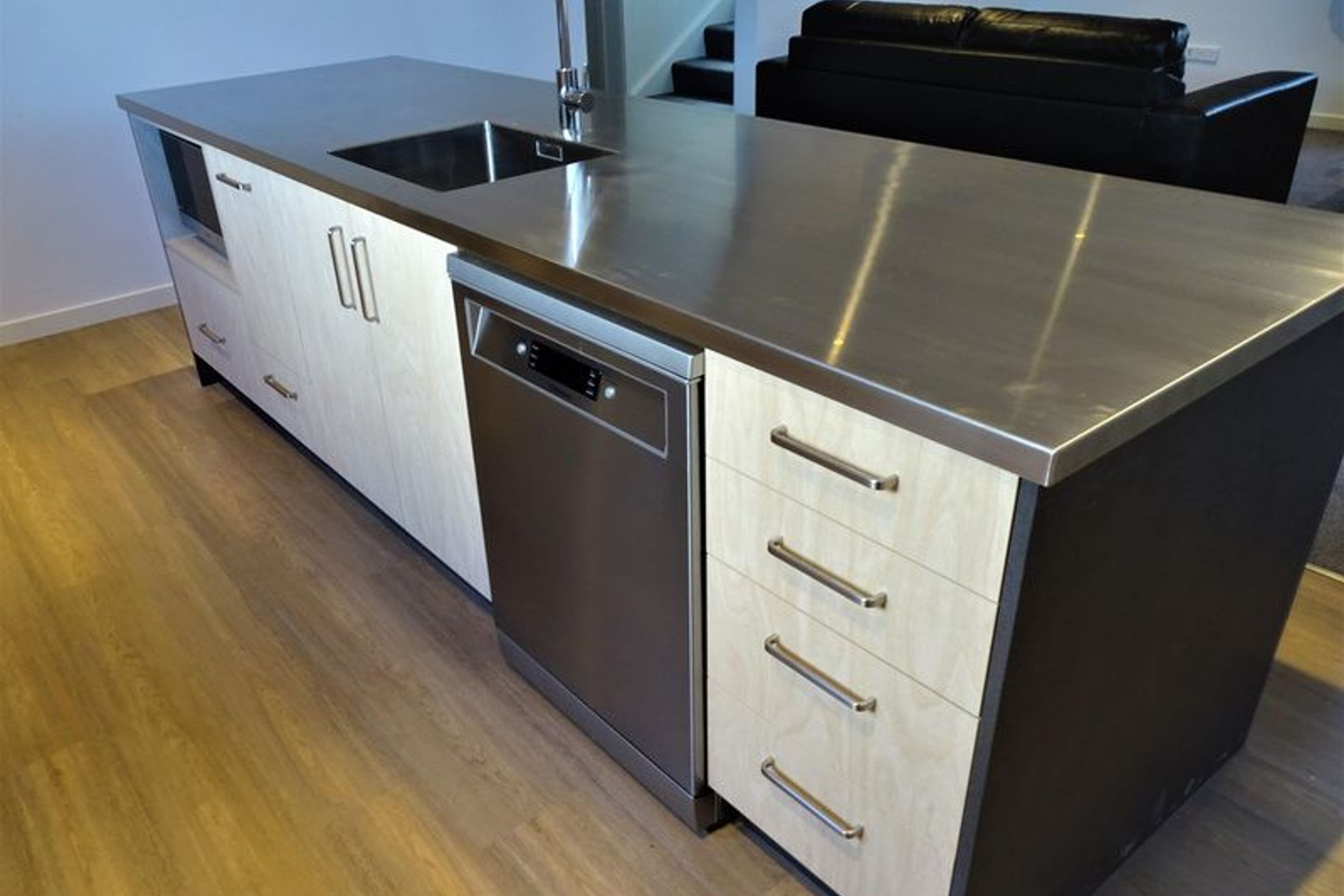 Breakfast bar area or kitchen island in Kitchen 1