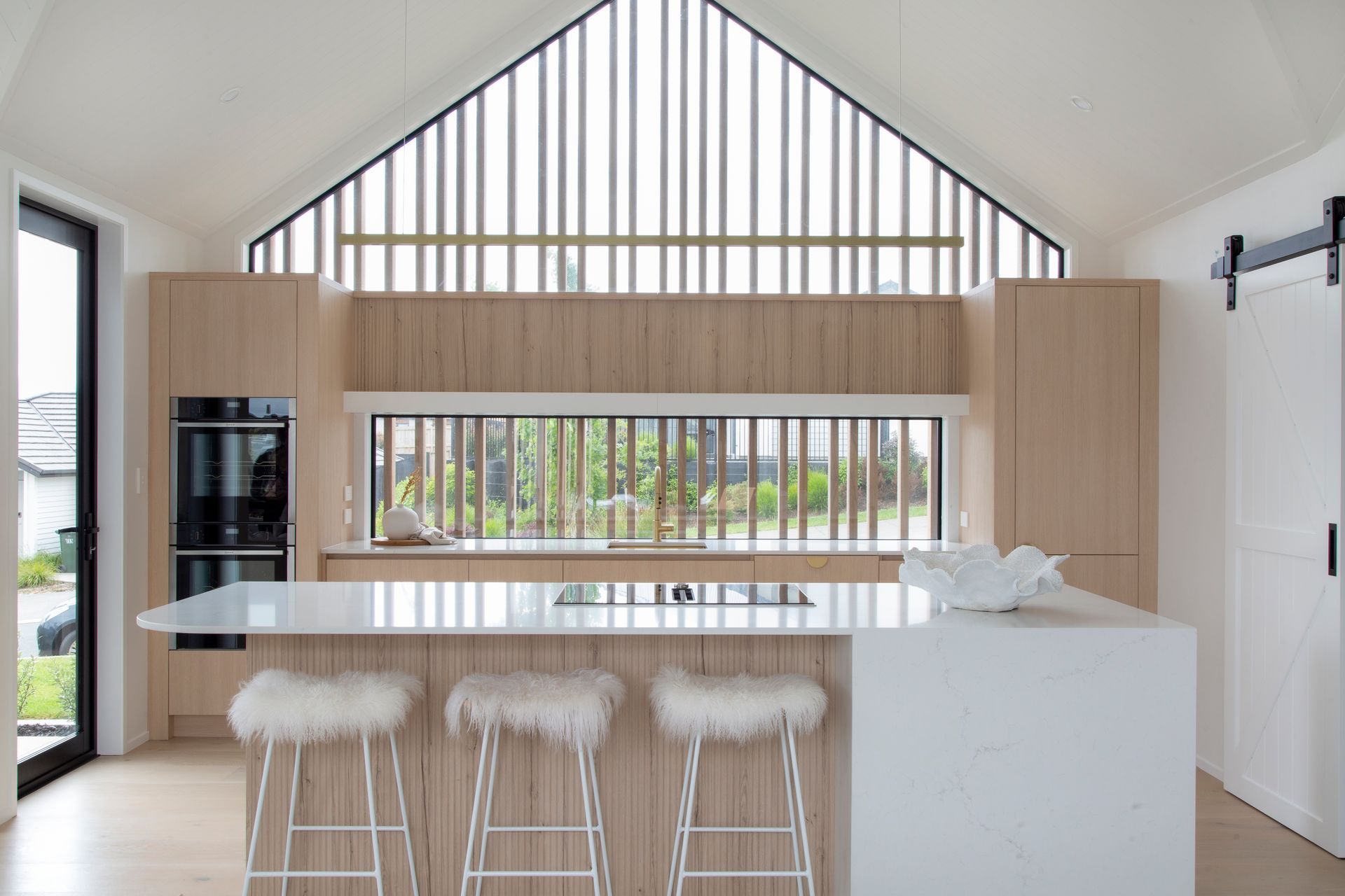 Dezignatek Cambridge Oak, Pragur Profile. Design by Kitchen Inspirations for Precision Homes