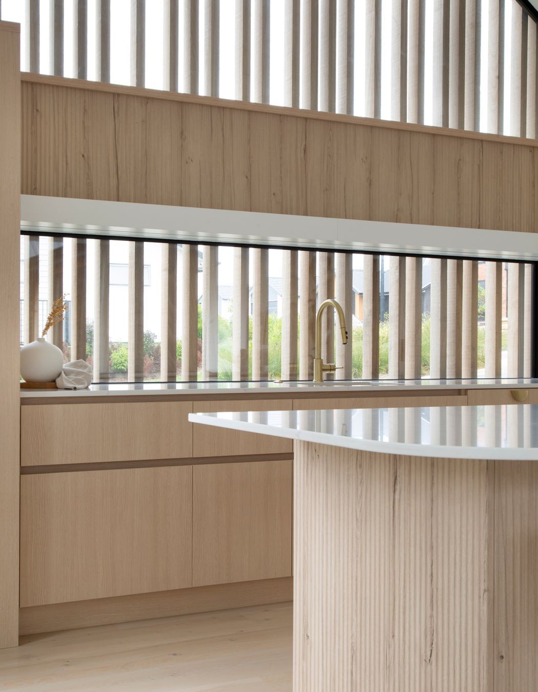 Dezignatek Cambridge Oak, Pragur Profile. Design by Kitchen Inspirations for Precision Homes