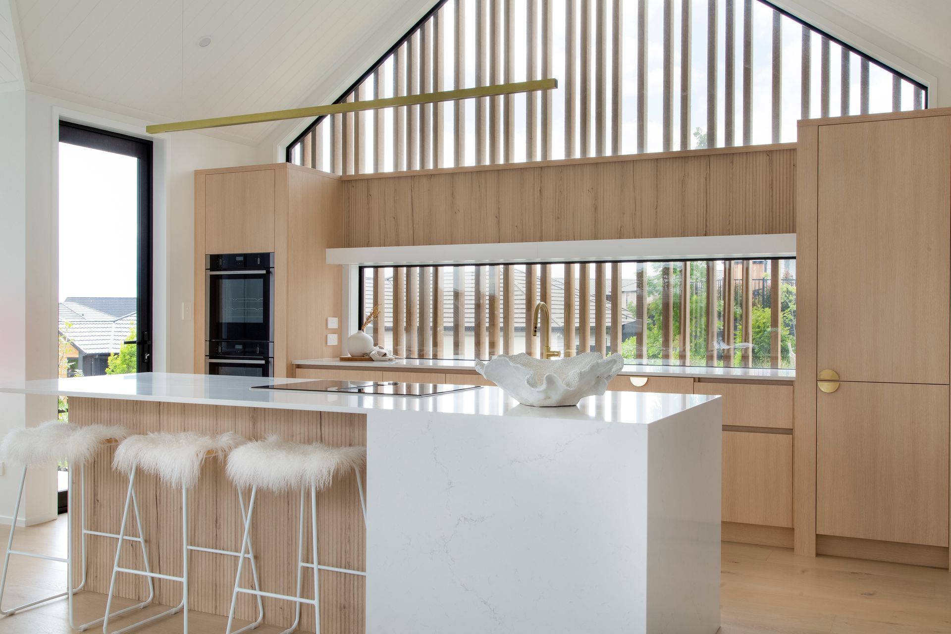Dezignatek Cambridge Oak, Pragur Profile. Design by Kitchen Inspirations for Precision Homes