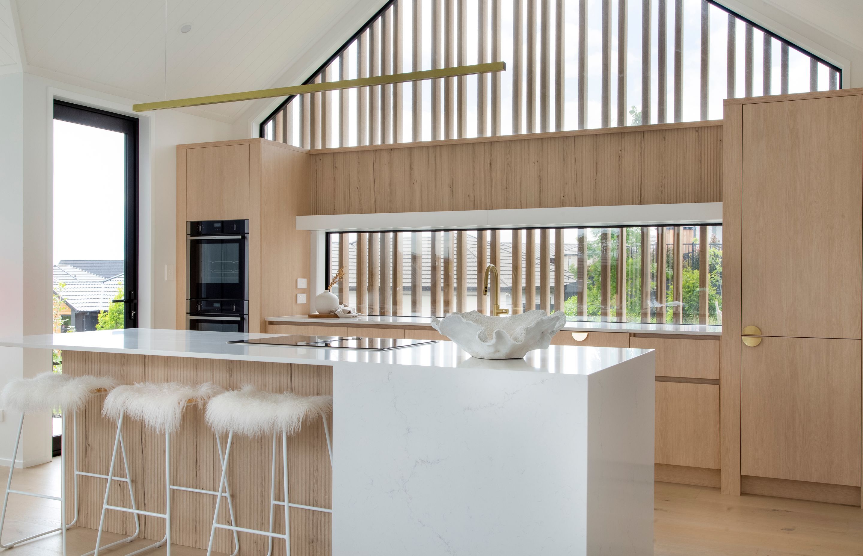 Dezignatek Cambridge Oak, Pragur Profile. Design by Kitchen Inspirations for Precision Homes