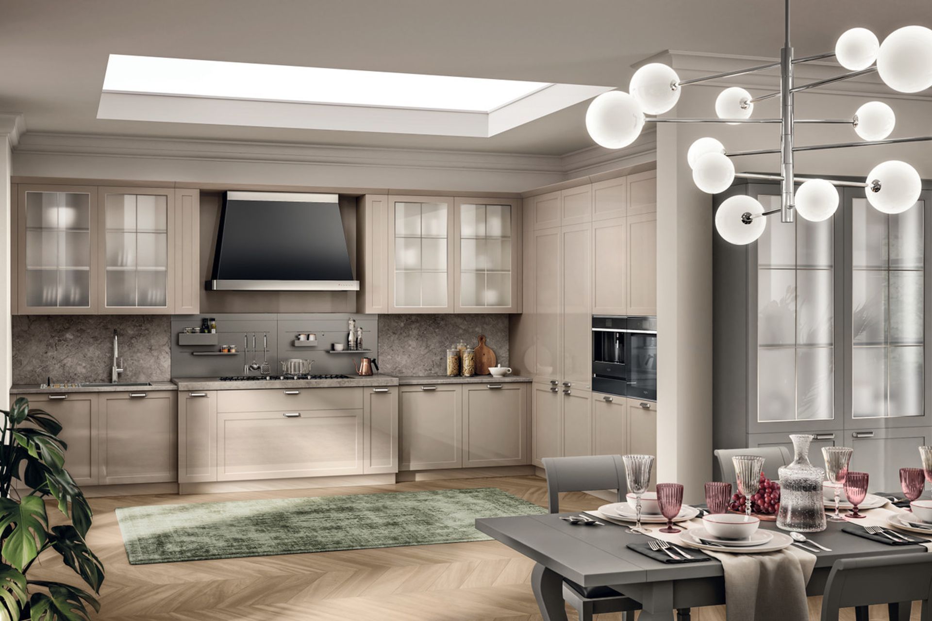 In a kitchen with a traditional layout, there is no shortage of interesting technical aspects: linear burners built into the Grigio Billiemi marble top and Opus equipped wall panel in painted metal in Desert and Silver Dark colours.
