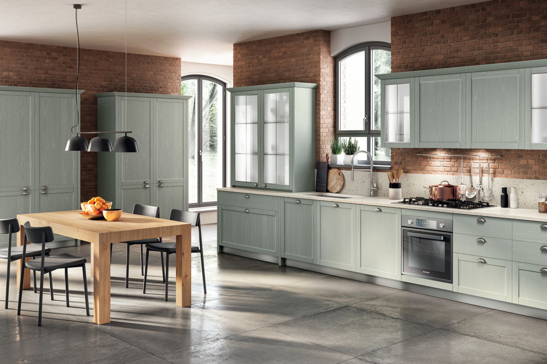 The rhythm of this particular Carattere composition is paced by the cup handles in matt aged Silver finish, which match the Capri Ash finish of the kitchen and the Motley quarz worktop to perfection.