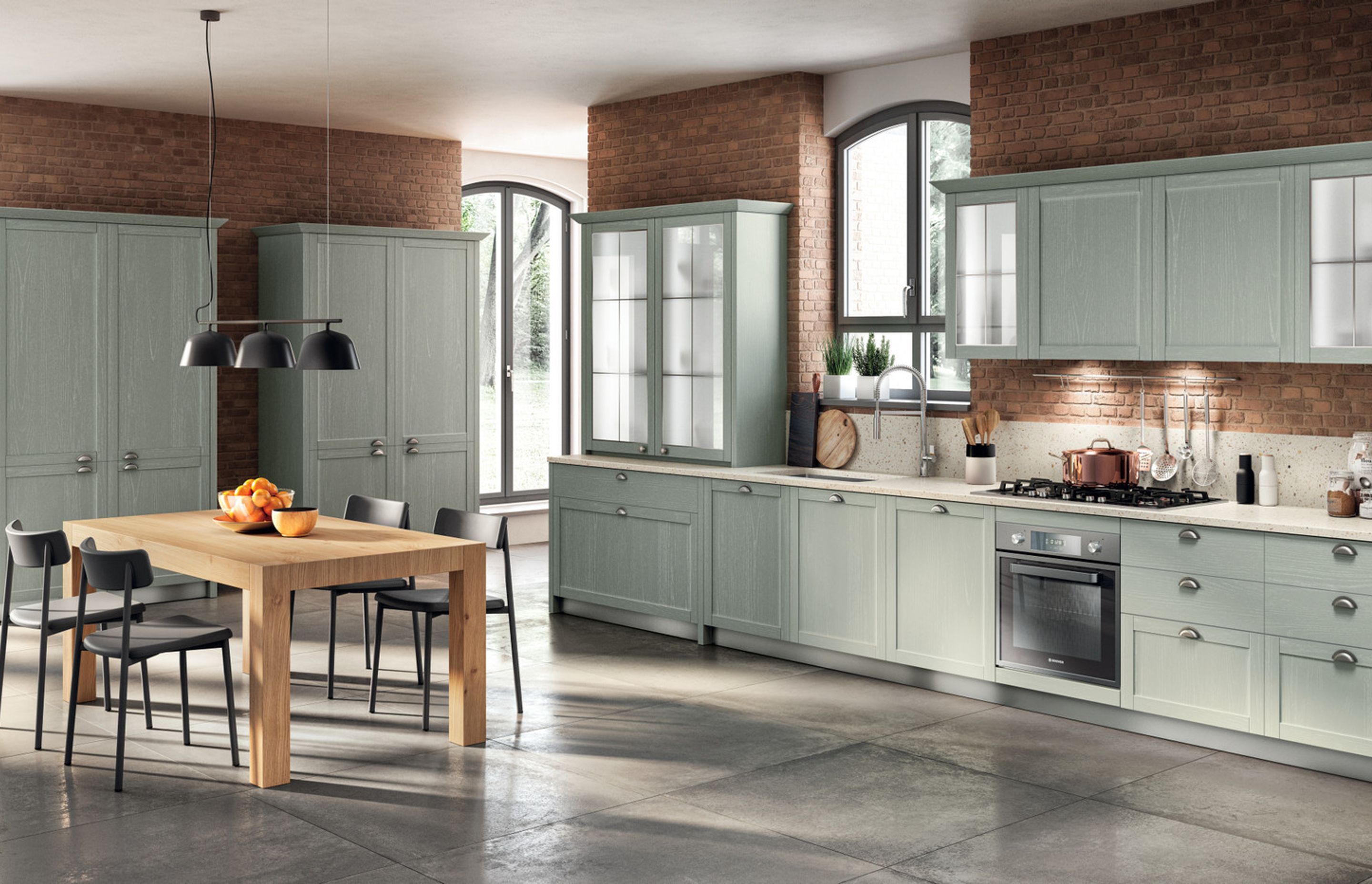The rhythm of this particular Carattere composition is paced by the cup handles in matt aged Silver finish, which match the Capri Ash finish of the kitchen and the Motley quarz worktop to perfection.